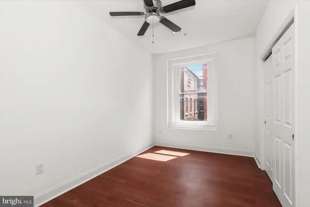 a living room with furniture a fireplace and a window