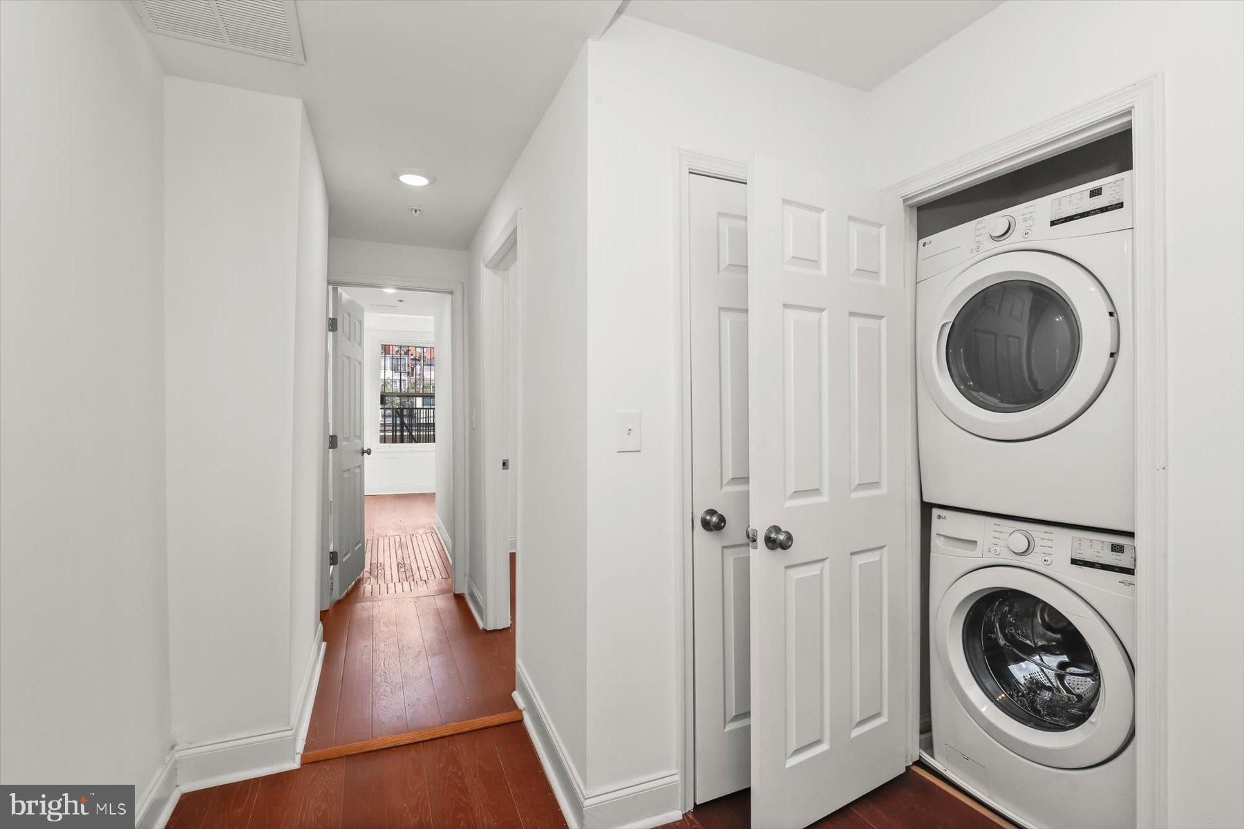 14 East Read Street Baltimore, MD 21202 - Photo 40 of 61 a view of a hallway with washer and dryer