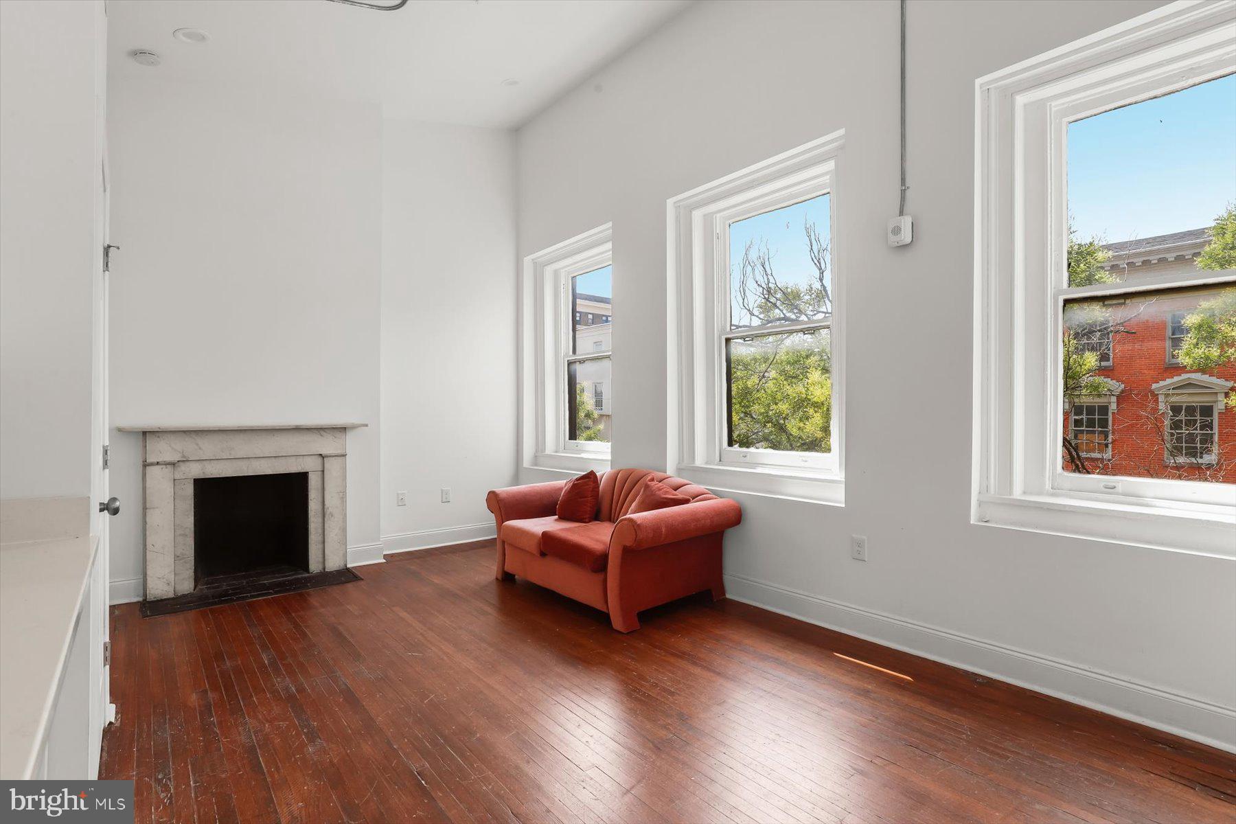 14 East Read Street Baltimore, MD 21202 - Photo 47 of 61 a living room with furniture and a fireplace