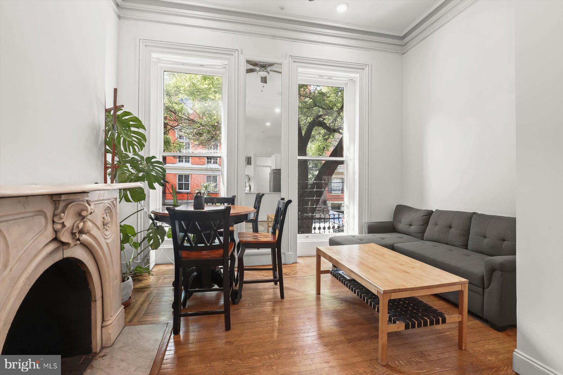 14 East Read Street Baltimore, MD 21202 - Photo 9 of 61 a living room with furniture and a fireplace