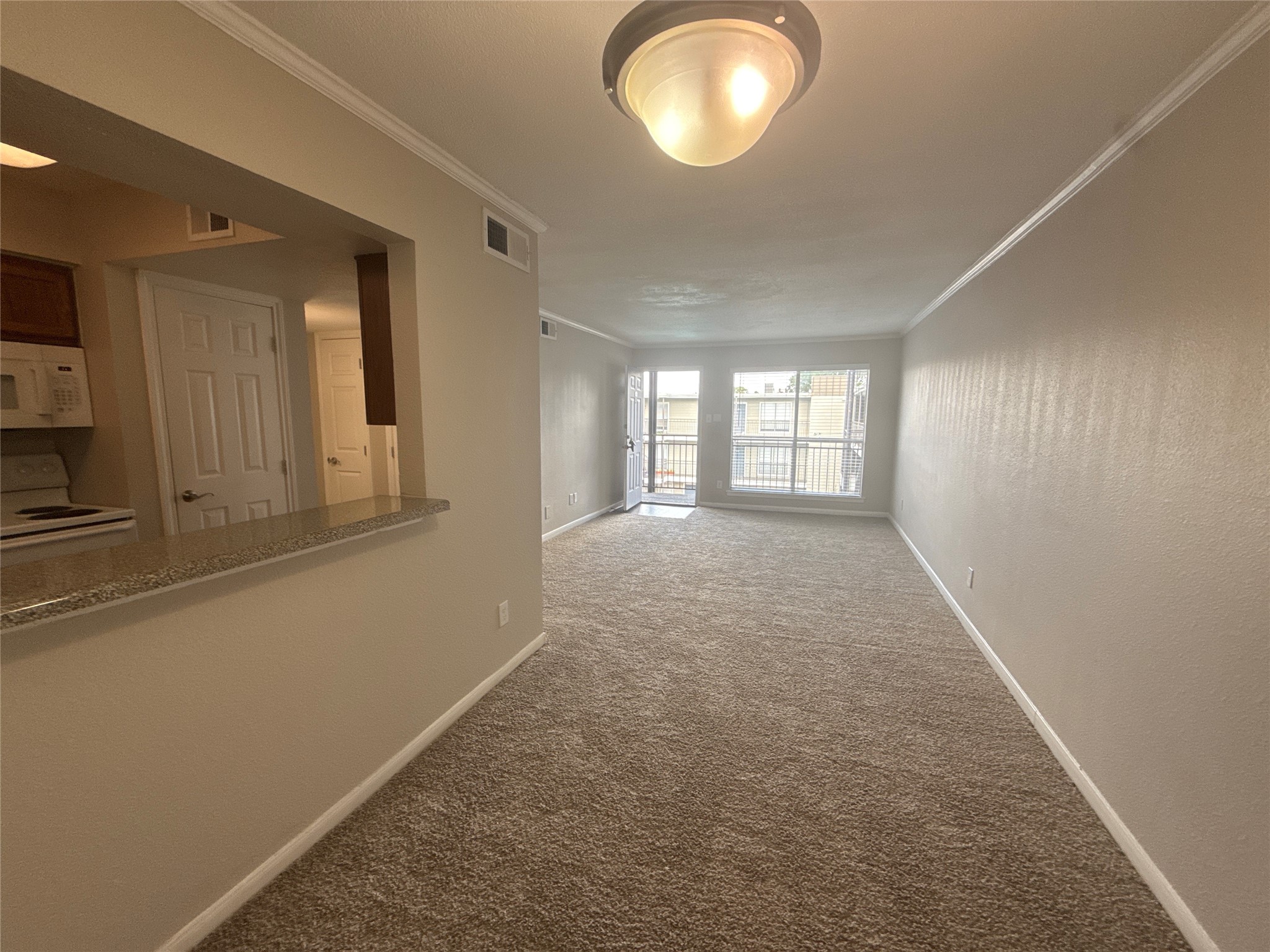 7315 Brompton Road, Unit 315B Houston, TX 77025 - Photo 4 of 13 wooden floor in an empty room with a window