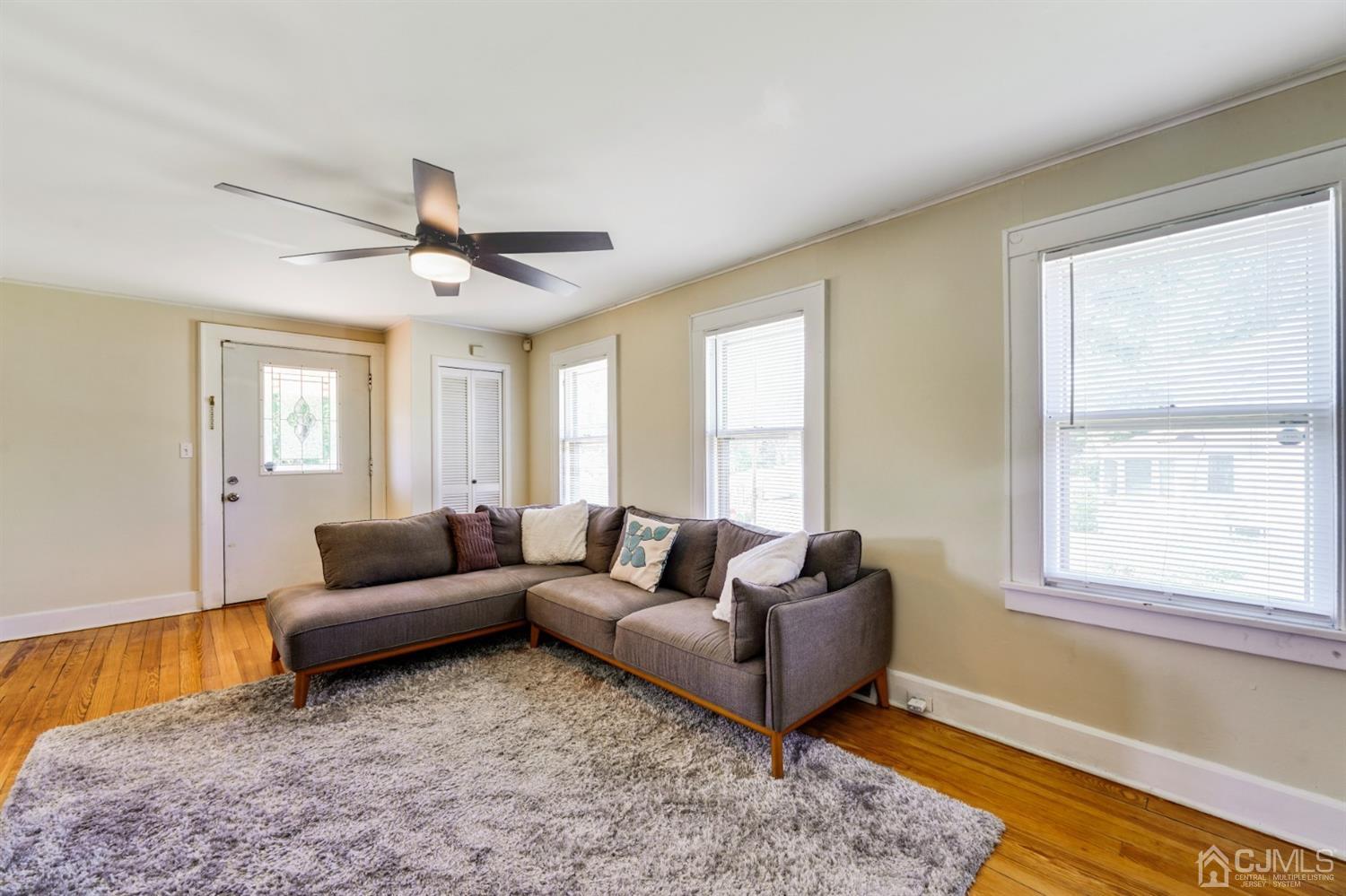 282 Greenbrook Road Plainfield, NJ 07060 - Photo 3 of 15 a living room with furniture and a large window