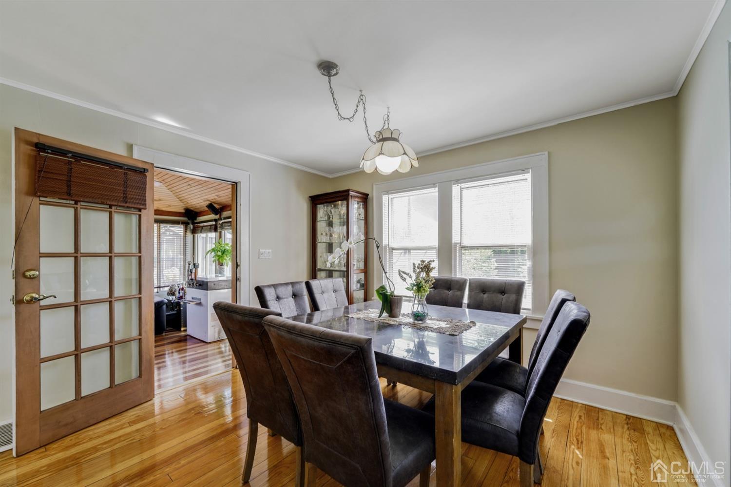 282 Greenbrook Road Plainfield, NJ 07060 - Photo 4 of 15 a dining room with furniture a chandelier and wooden floor