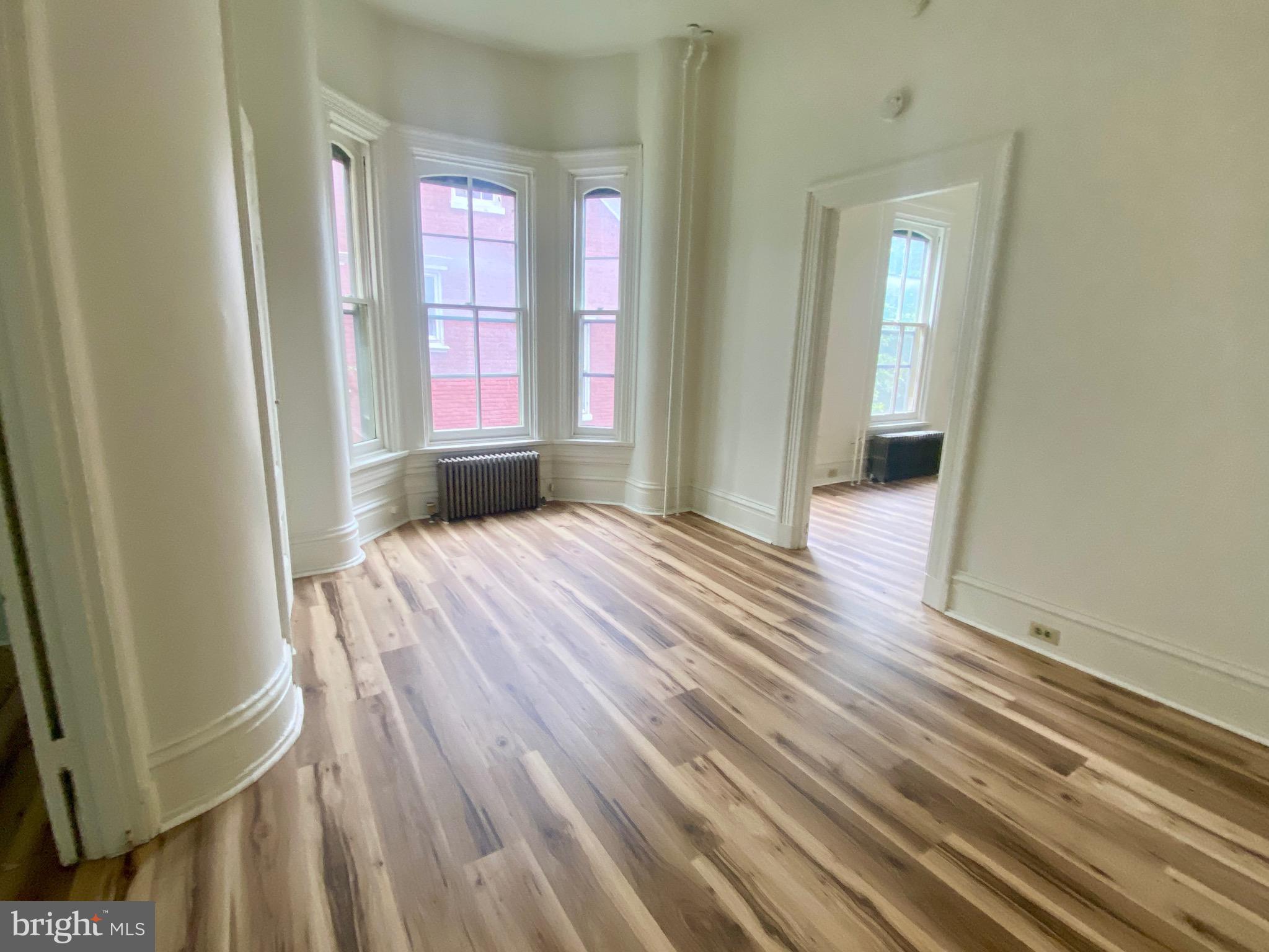 26 South 2nd Street, Unit 2 Columbia, PA 17512 - Photo 1 of 14 a view of a room with wooden floor and walls