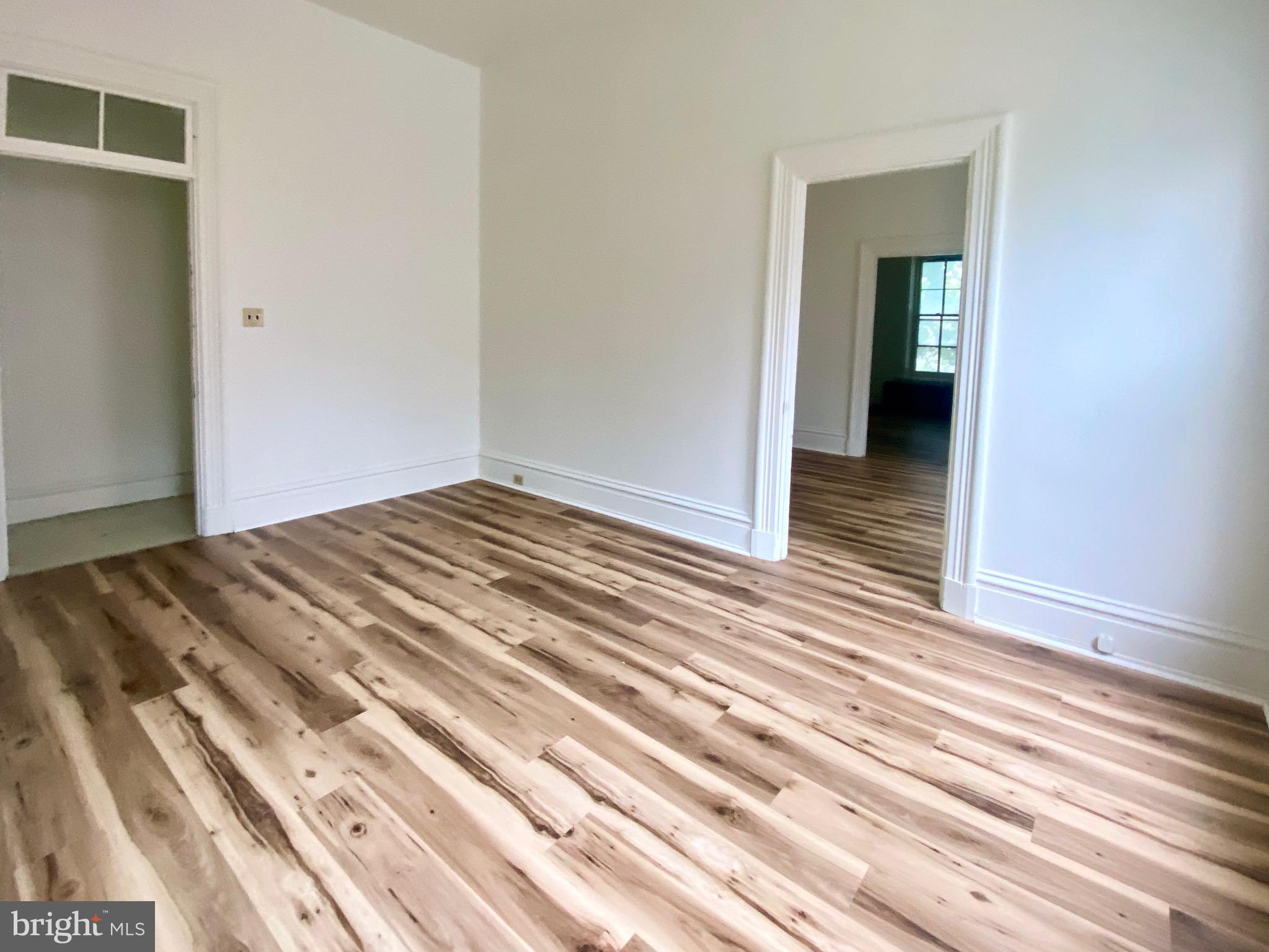 26 South 2nd Street, Unit 2 Columbia, PA 17512 - Photo 14 of 14 a view of a bedroom with wooden floor and closet