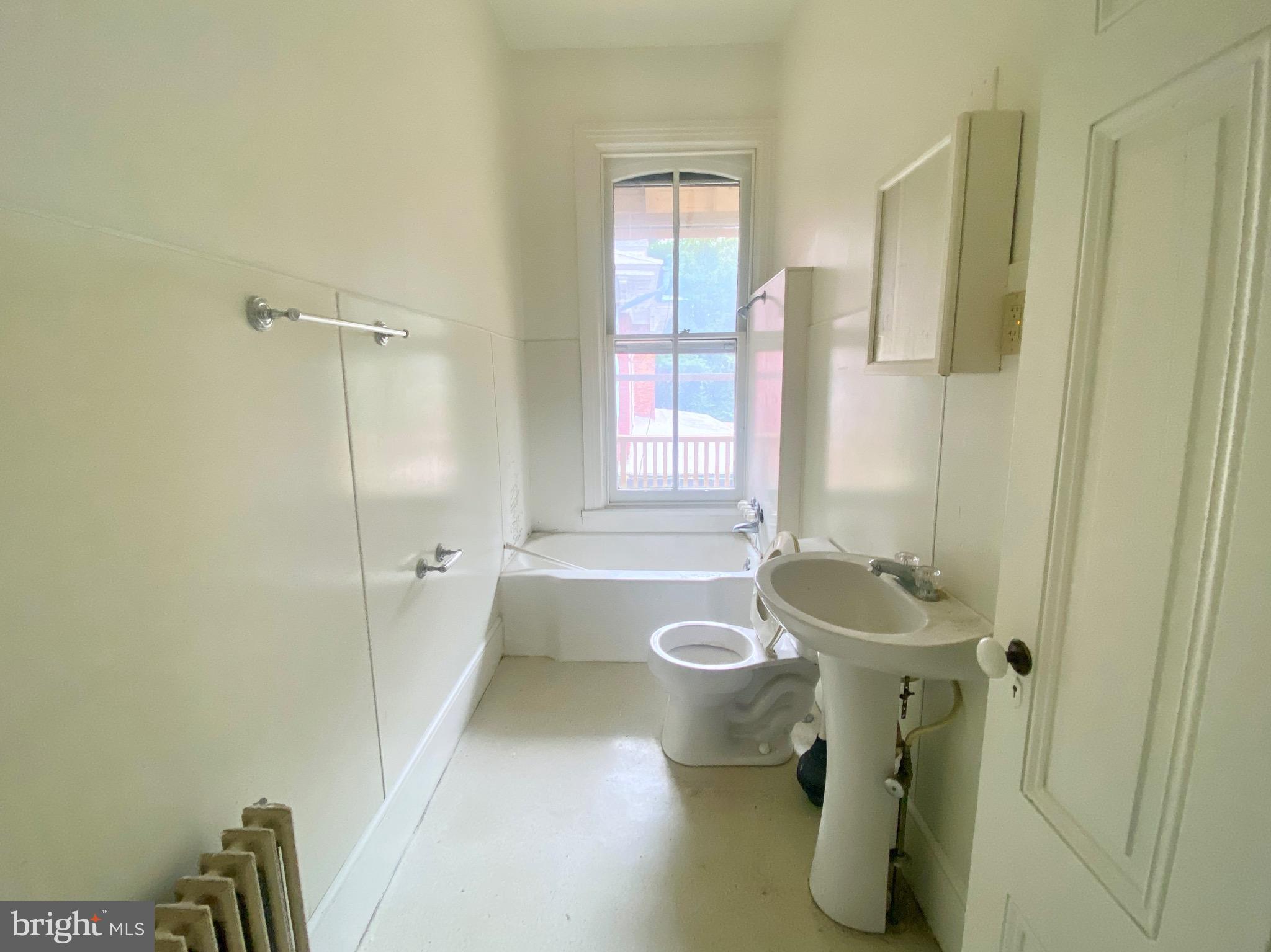 26 South 2nd Street, Unit 2 Columbia, PA 17512 - Photo 5 of 14 a bathroom with a sink a toilet and shower