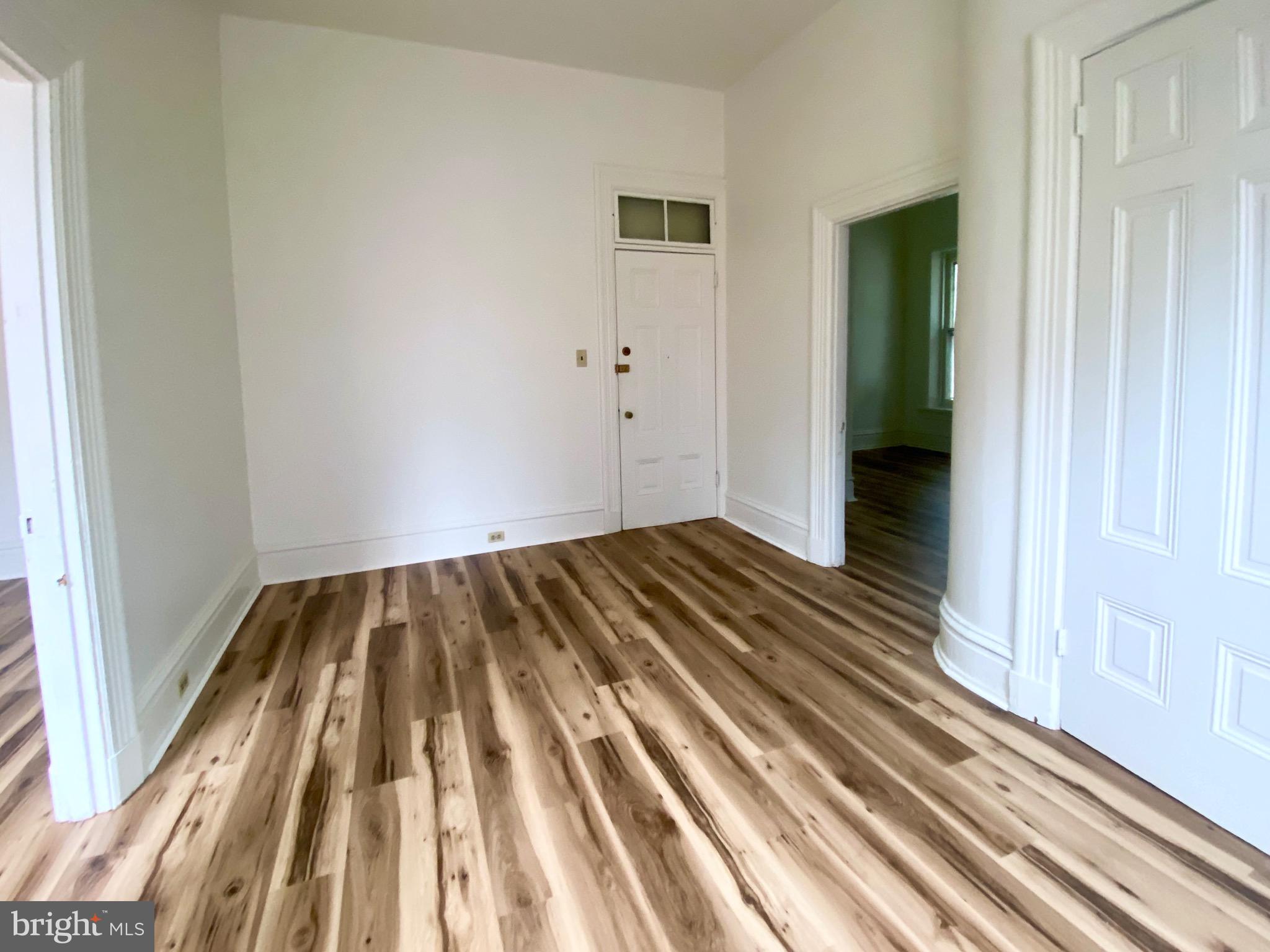 26 South 2nd Street, Unit 2 Columbia, PA 17512 - Photo 6 of 14 a view of a room with wooden floor and staircase