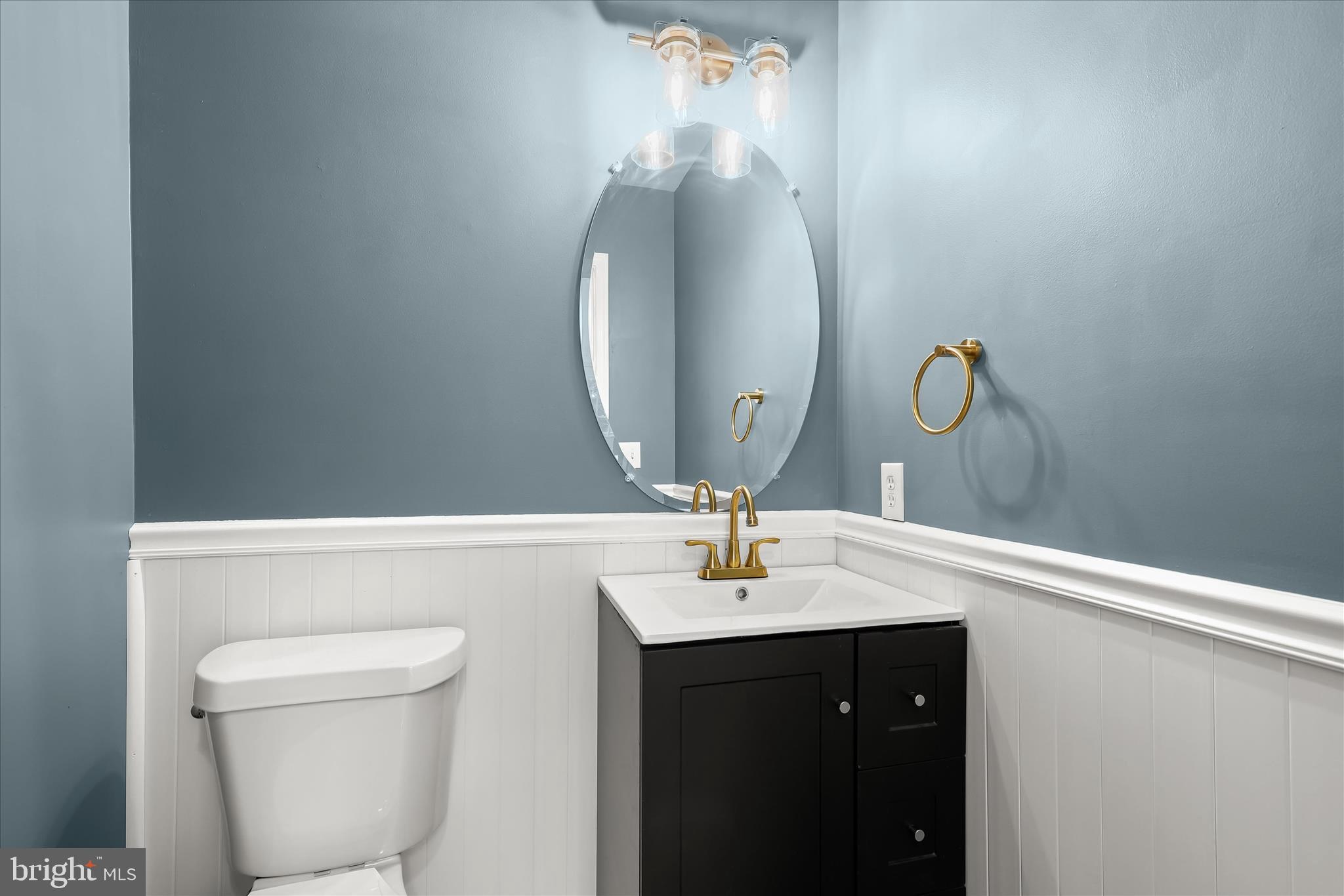 147 Idlewild Road Severna Park, MD 21146 - Photo 12 of 36 a bathroom with a sink and a mirror