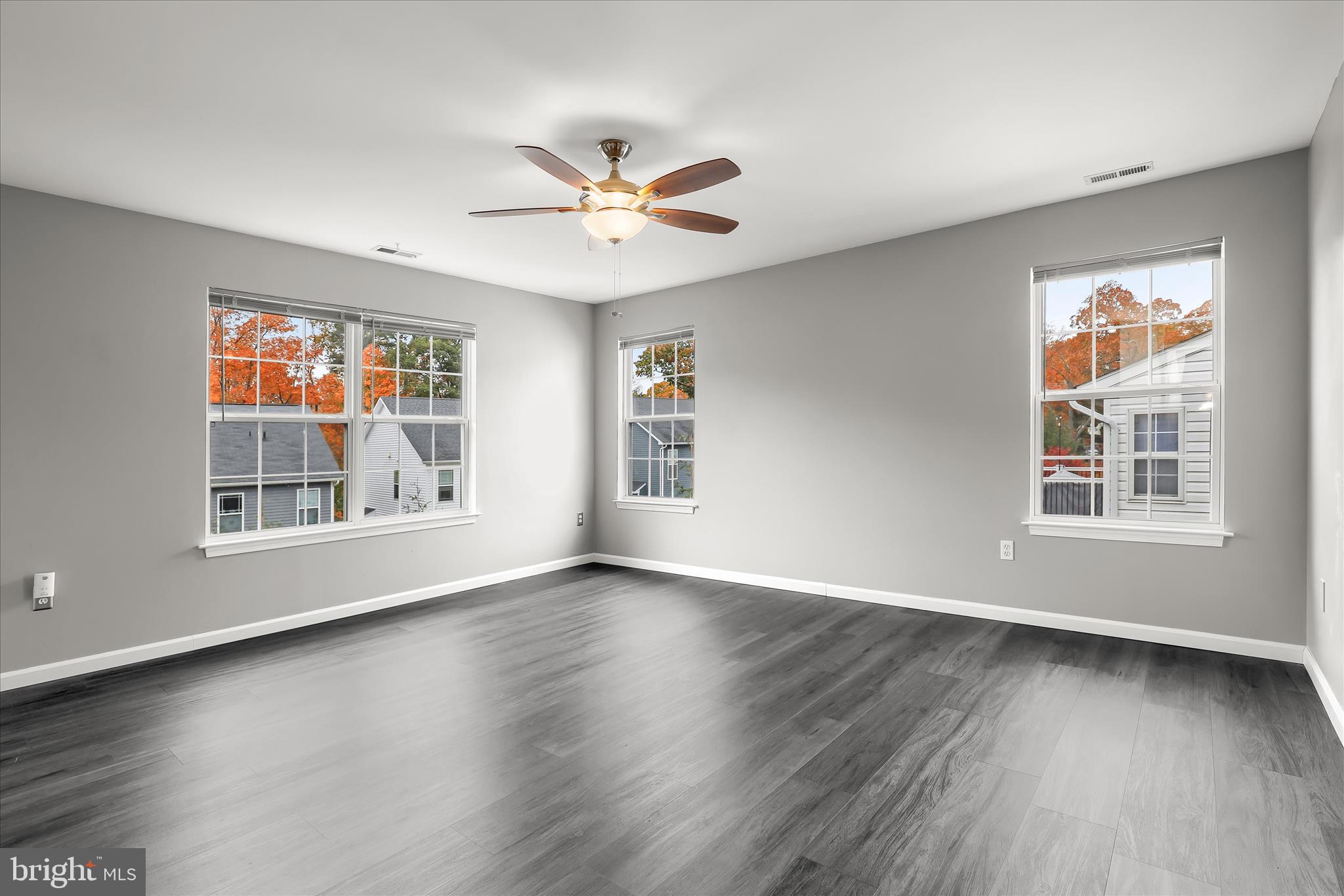 147 Idlewild Road Severna Park, MD 21146 - Photo 16 of 36 a view of an empty room with a window and wooden floor