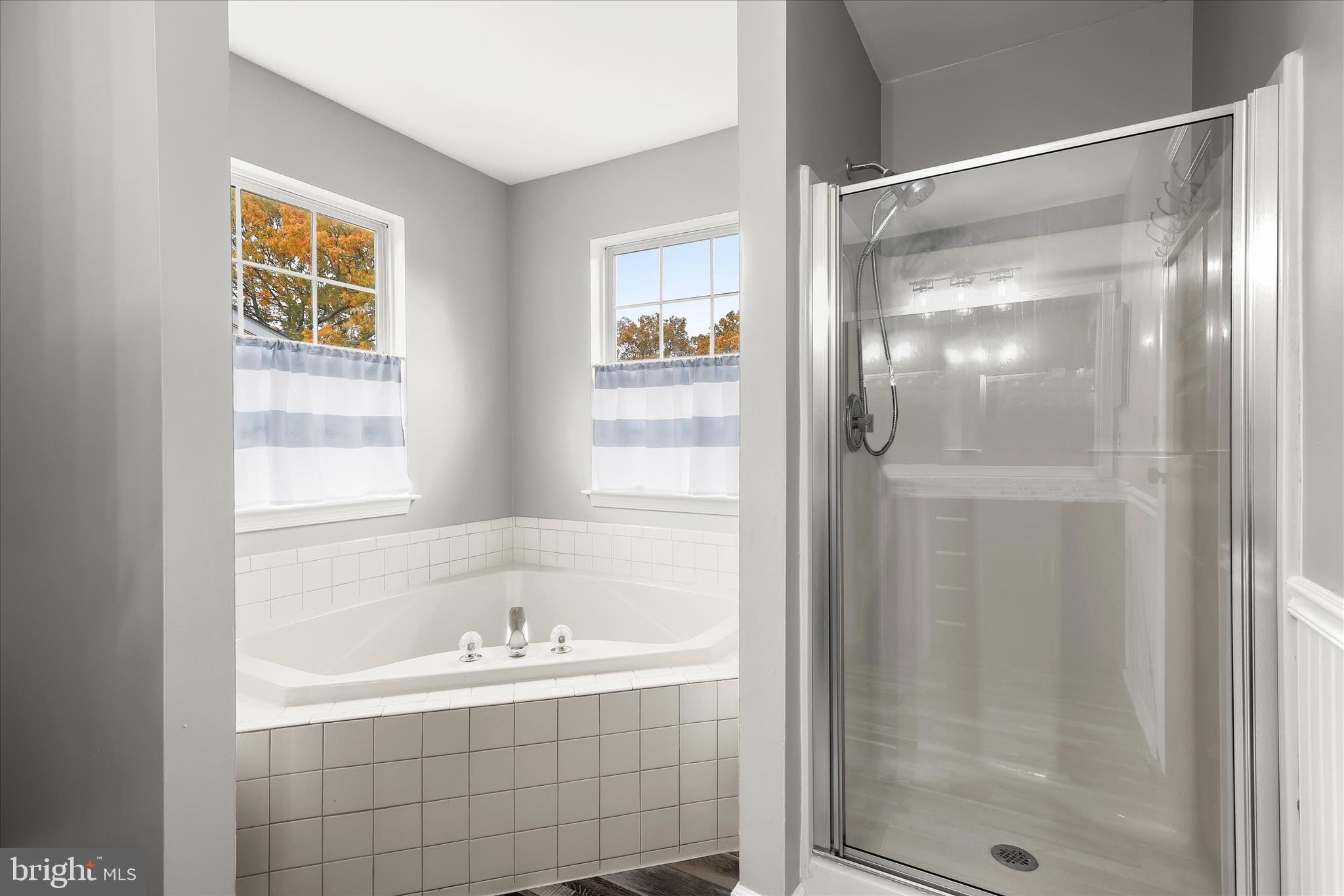 147 Idlewild Road Severna Park, MD 21146 - Photo 20 of 36 a bathroom with a bathtub and a shower