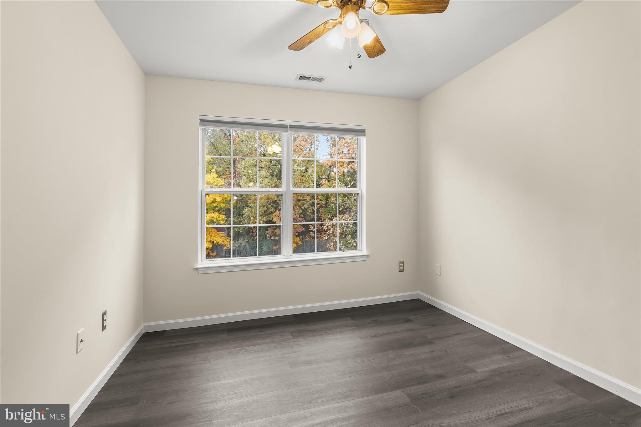 147 Idlewild Road Severna Park, MD 21146 - Photo 22 of 36 an empty room with wooden floor and windows