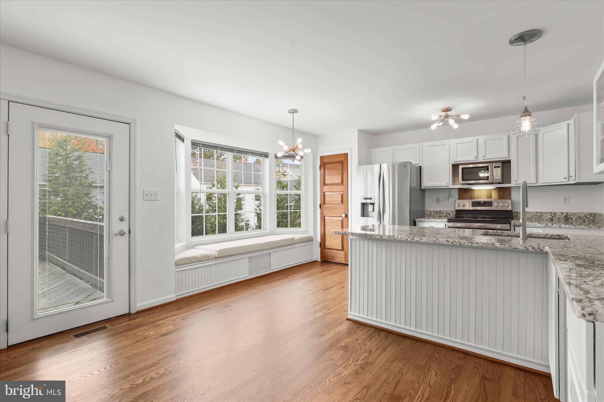 147 Idlewild Road Severna Park, MD 21146 - Photo 5 of 36 a kitchen with stainless steel appliances granite countertop a stove a sink wooden cabinets and a refrigerator