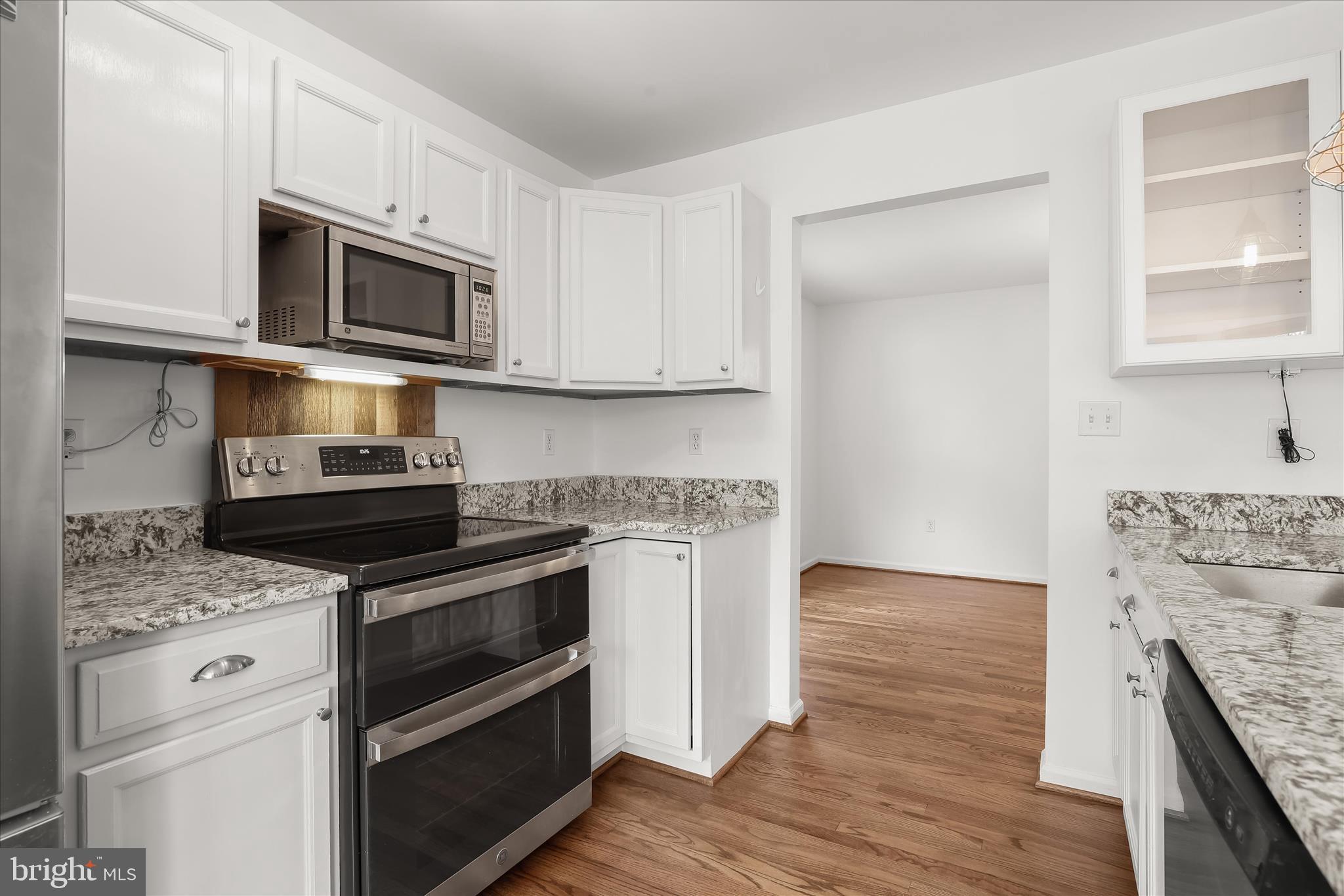 147 Idlewild Road Severna Park, MD 21146 - Photo 7 of 36 a kitchen with stainless steel appliances a stove microwave and sink