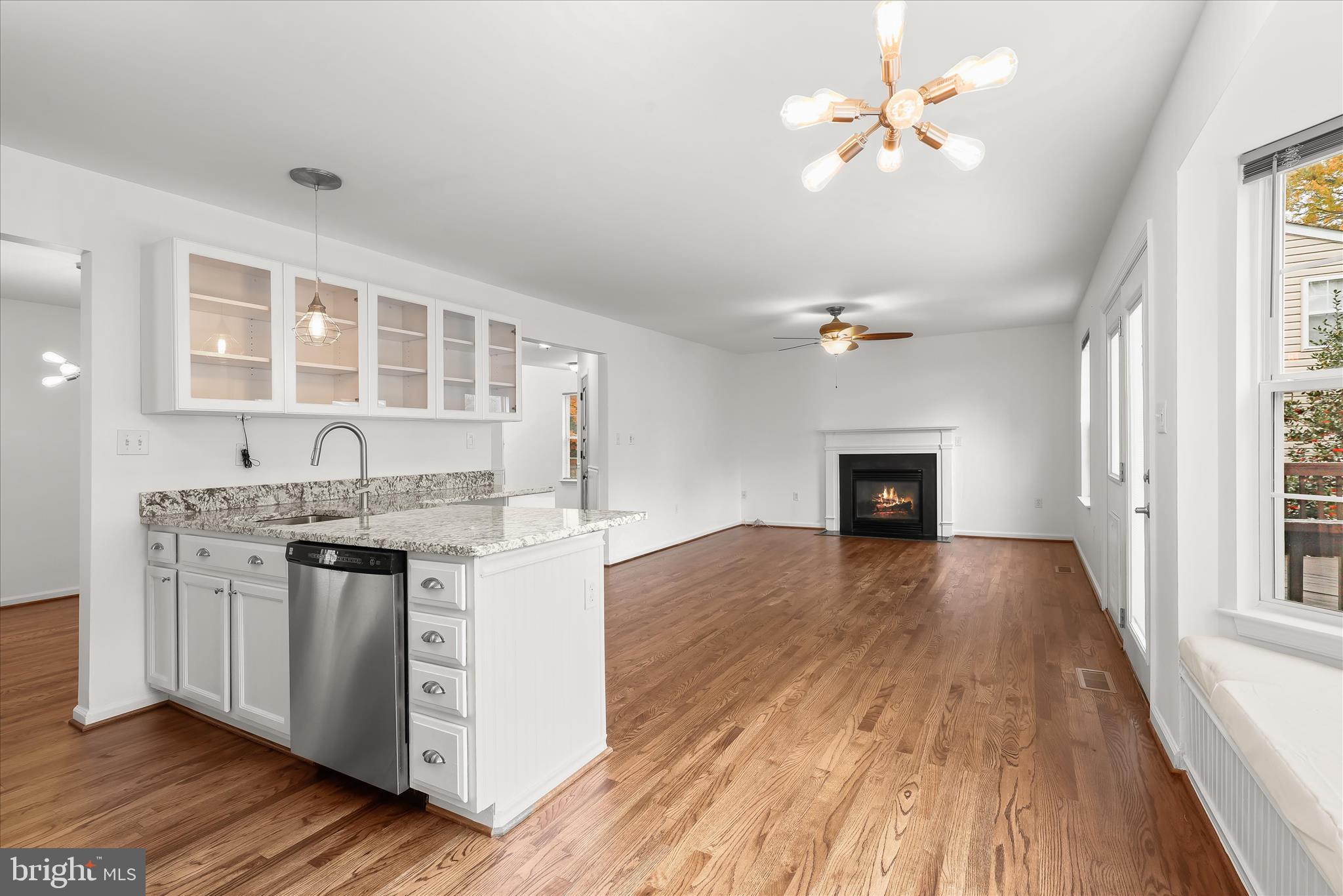 147 Idlewild Road Severna Park, MD 21146 - Photo 9 of 36 a kitchen with granite countertop a stove a sink and a refrigerator