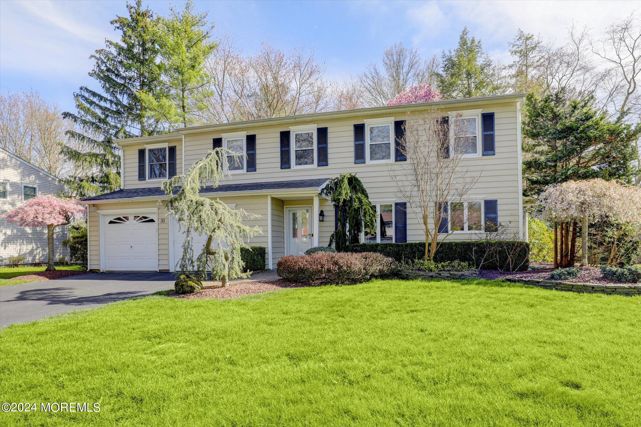 31 Shady Lane Freehold, NJ 07728 - Photo 1 of 40 a front view of house with yard and green space