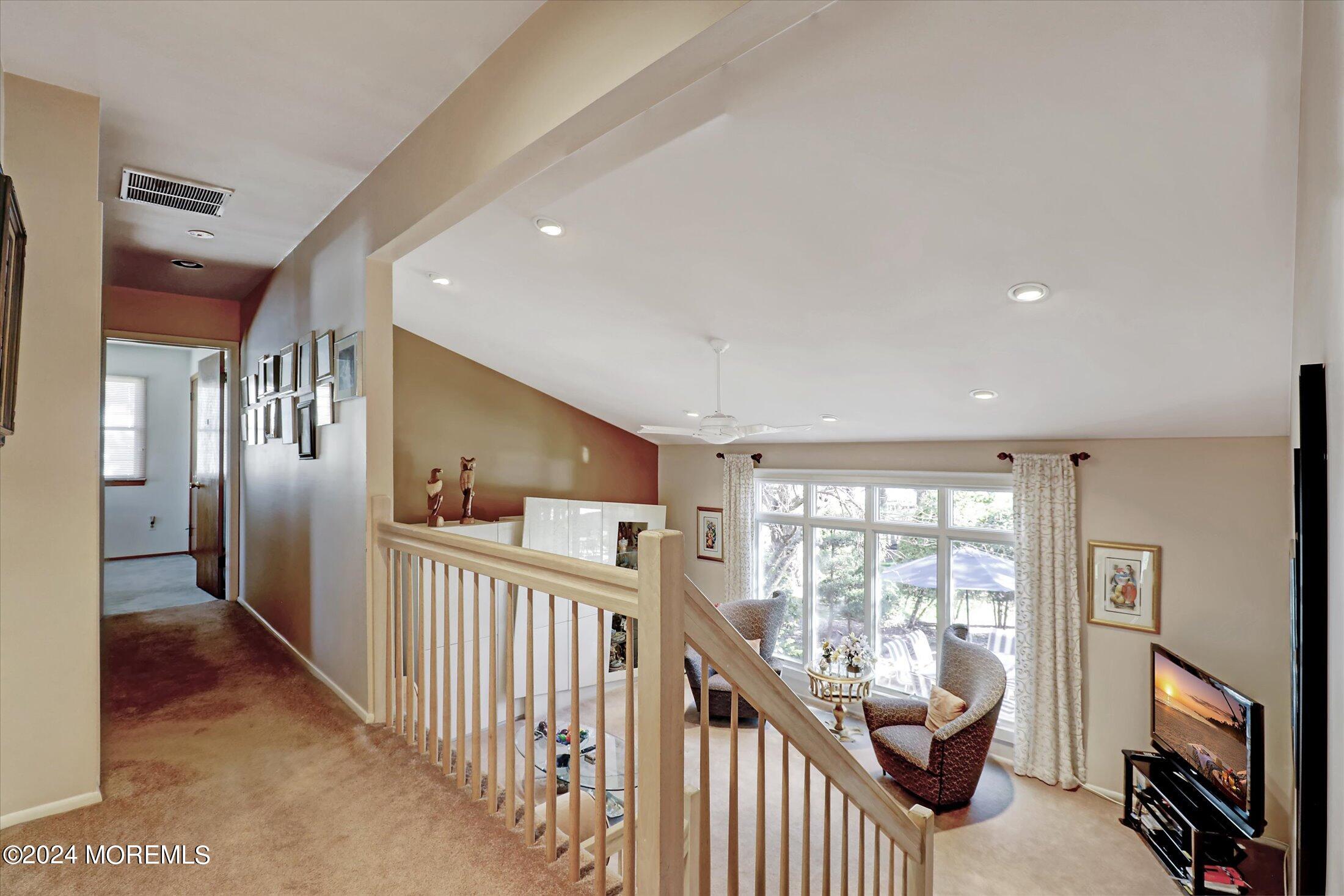 31 Shady Lane Freehold, NJ 07728 - Photo 17 of 40 a view of a hallway with furniture and windows