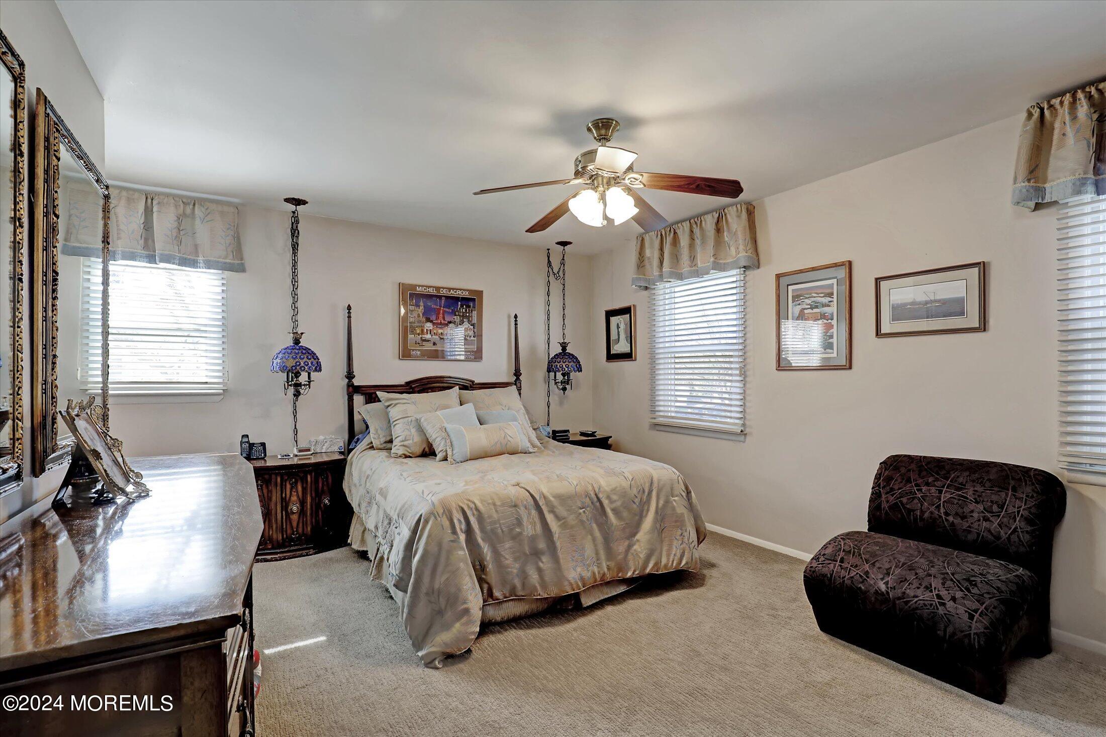 31 Shady Lane Freehold, NJ 07728 - Photo 18 of 40 a bedroom with a bed couches chair and a window