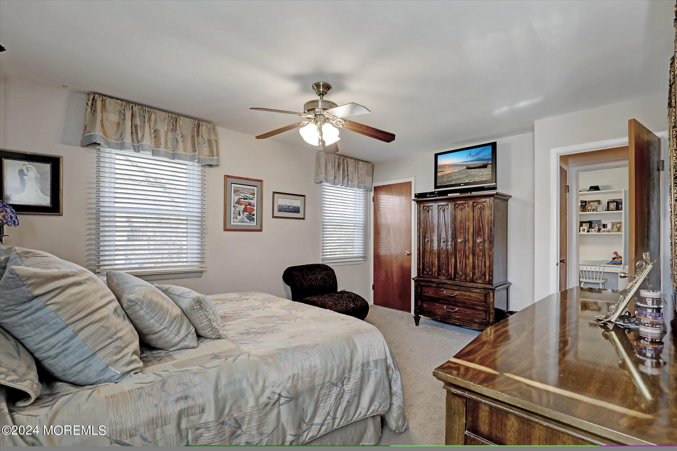 31 Shady Lane Freehold, NJ 07728 - Photo 19 of 40 a bedroom with a bed dresser and a window