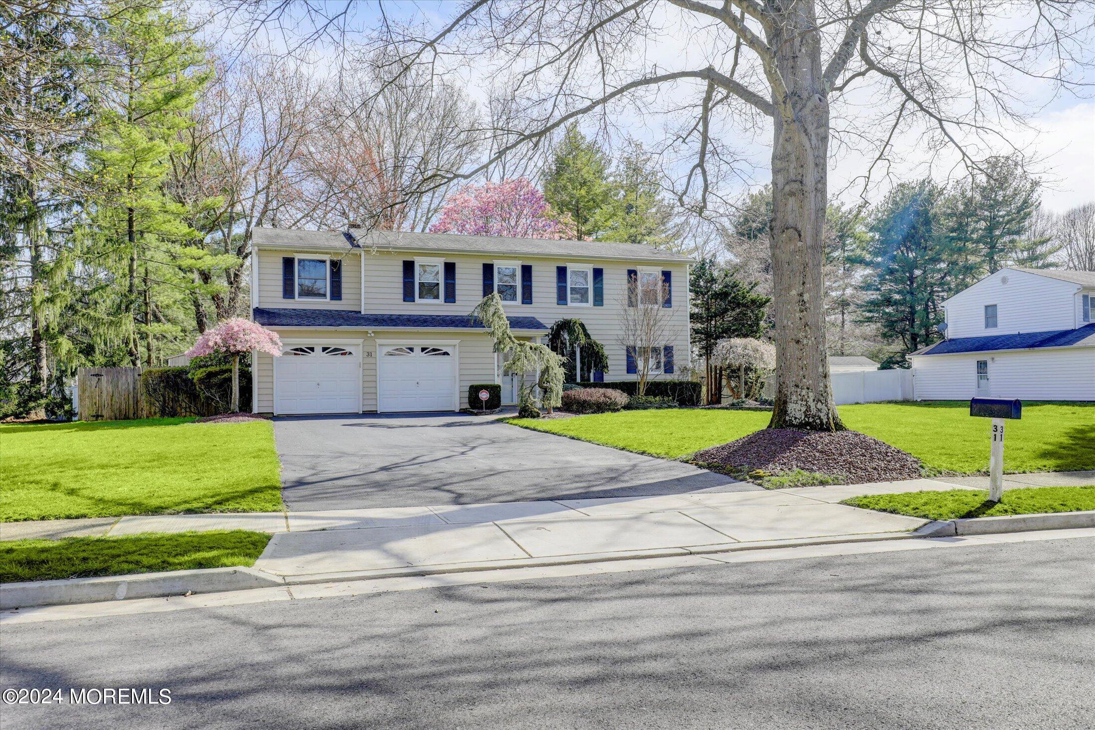 31 Shady Lane Freehold, NJ 07728 - Photo 2 of 40 a front view of house with yard and green space