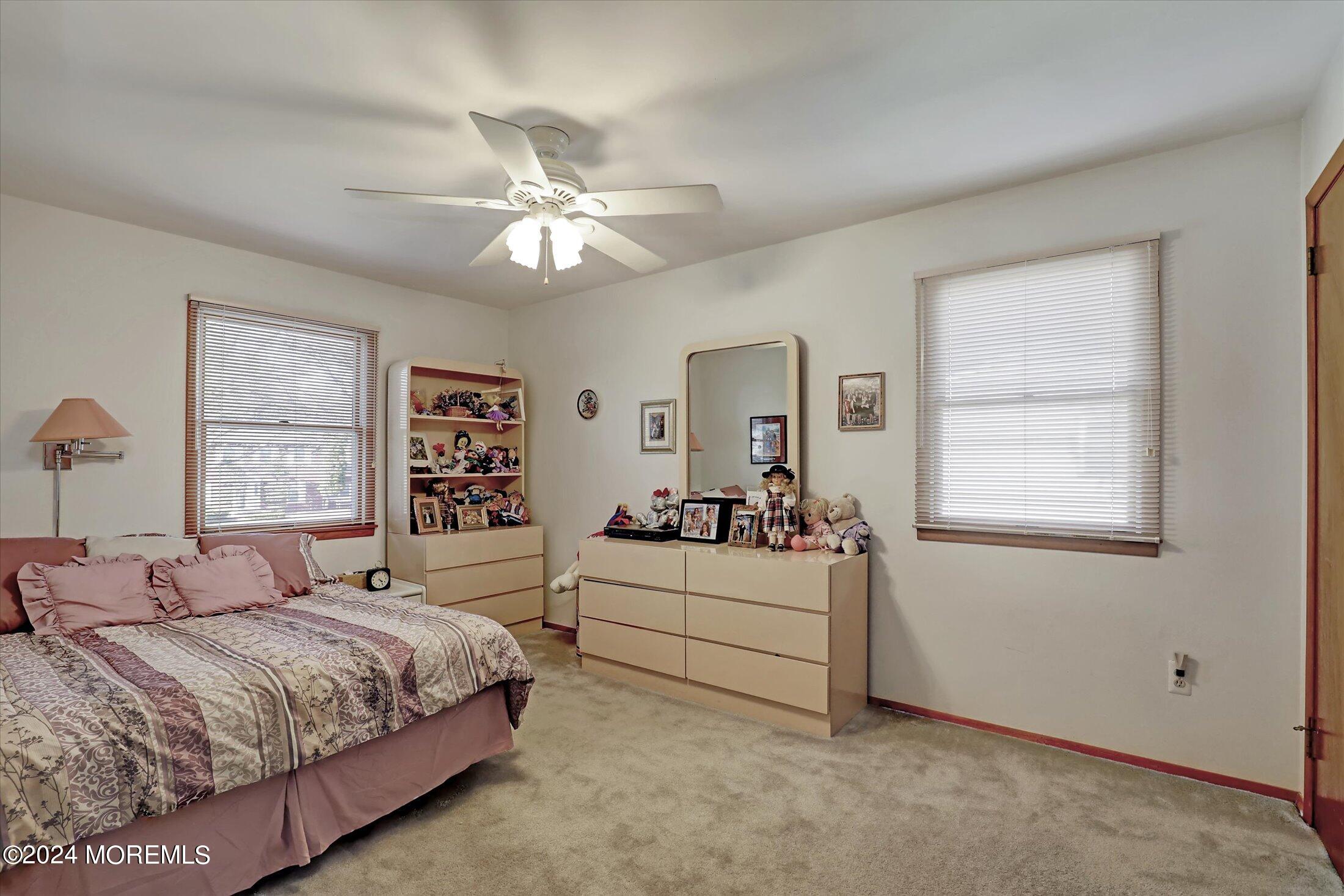 31 Shady Lane Freehold, NJ 07728 - Photo 21 of 40 a spacious bedroom with a bed and a window