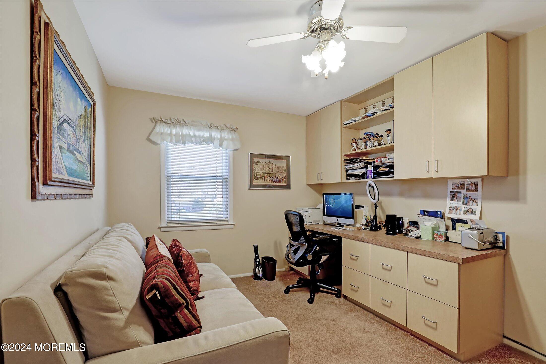 31 Shady Lane Freehold, NJ 07728 - Photo 23 of 40 a view of a livingroom with workspace and a couch