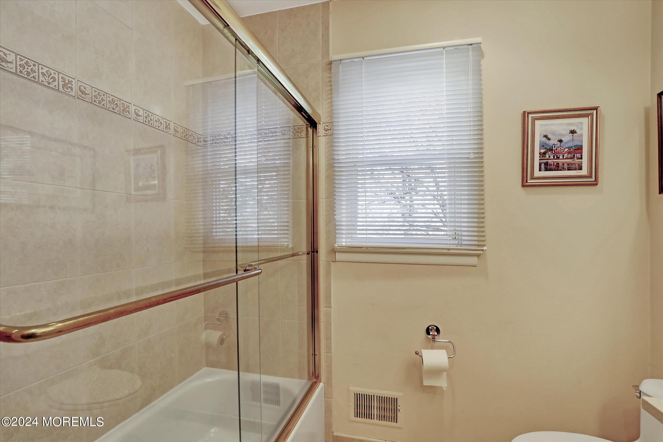 31 Shady Lane Freehold, NJ 07728 - Photo 25 of 40 a bathroom with a shower and a sink