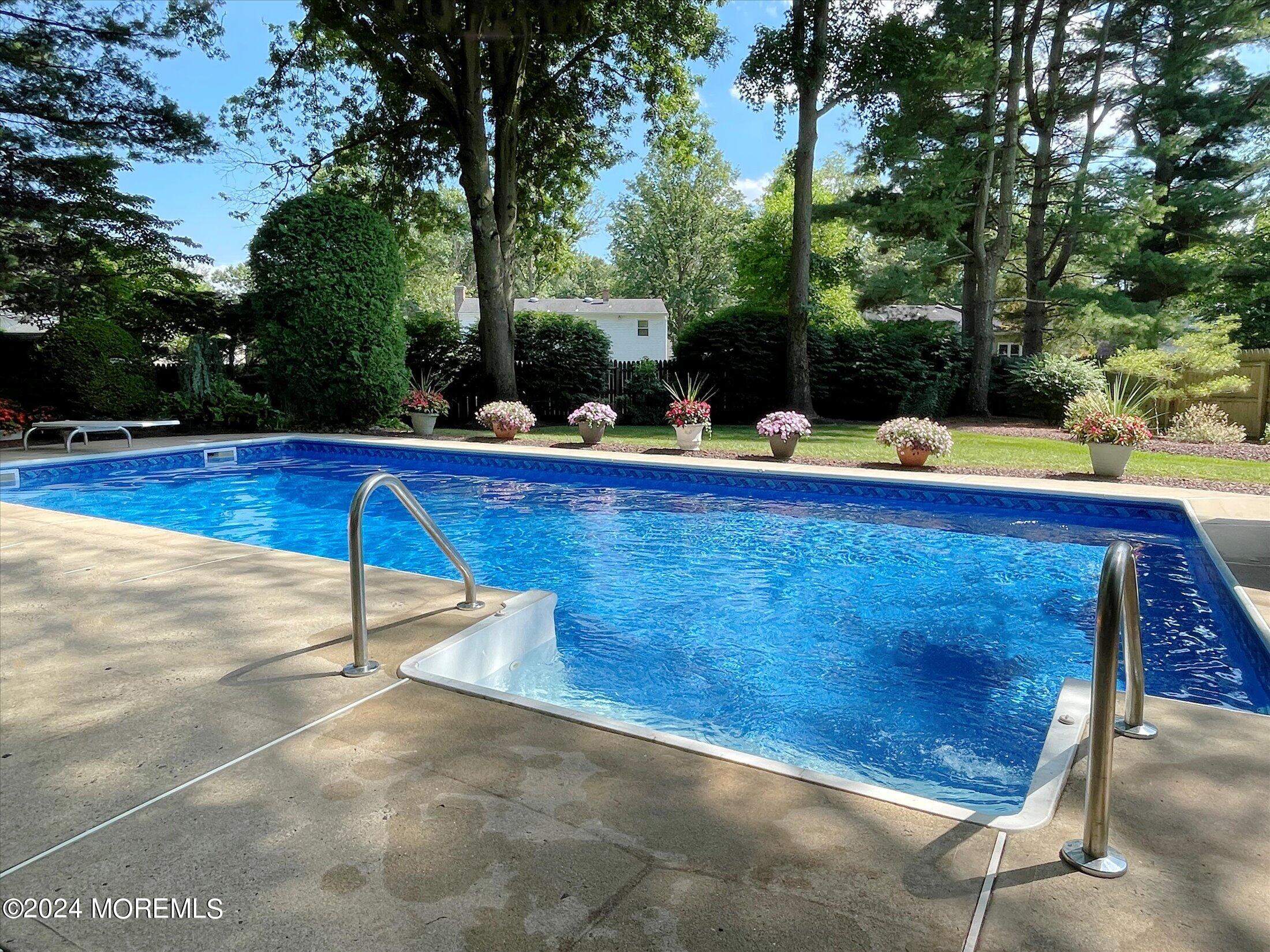 31 Shady Lane Freehold, NJ 07728 - Photo 30 of 40 a view of a backyard with sitting area
