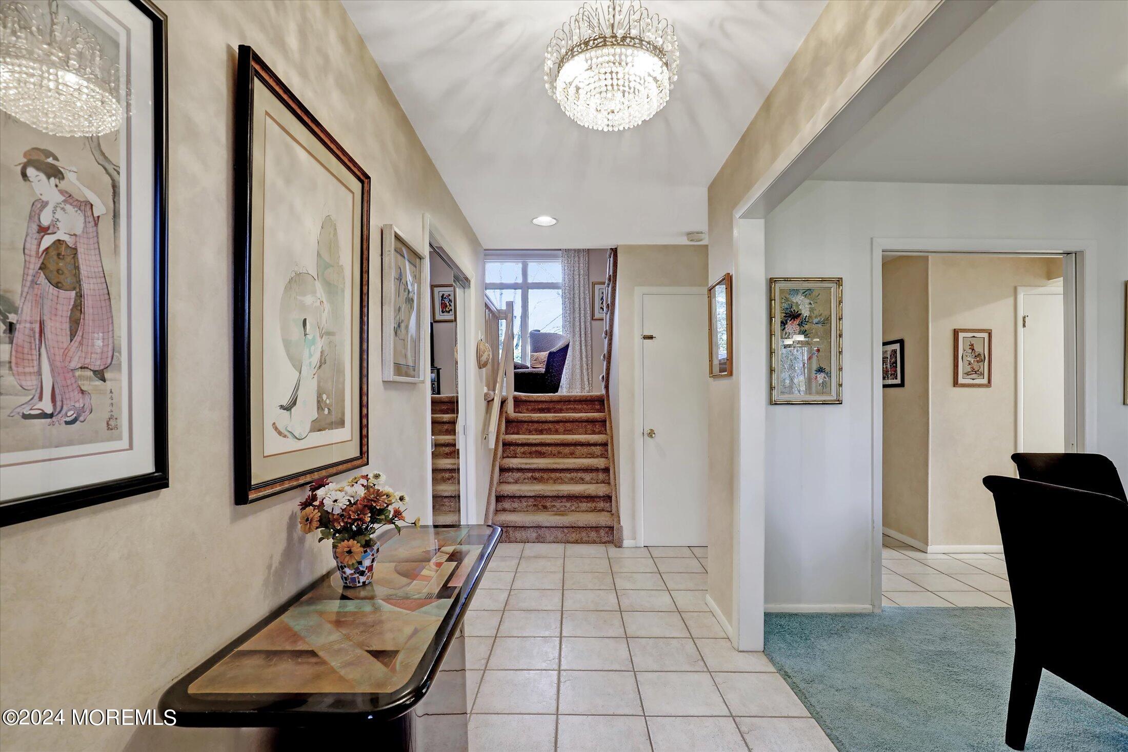 31 Shady Lane Freehold, NJ 07728 - Photo 3 of 40 a view of a hallway with furniture and entryway