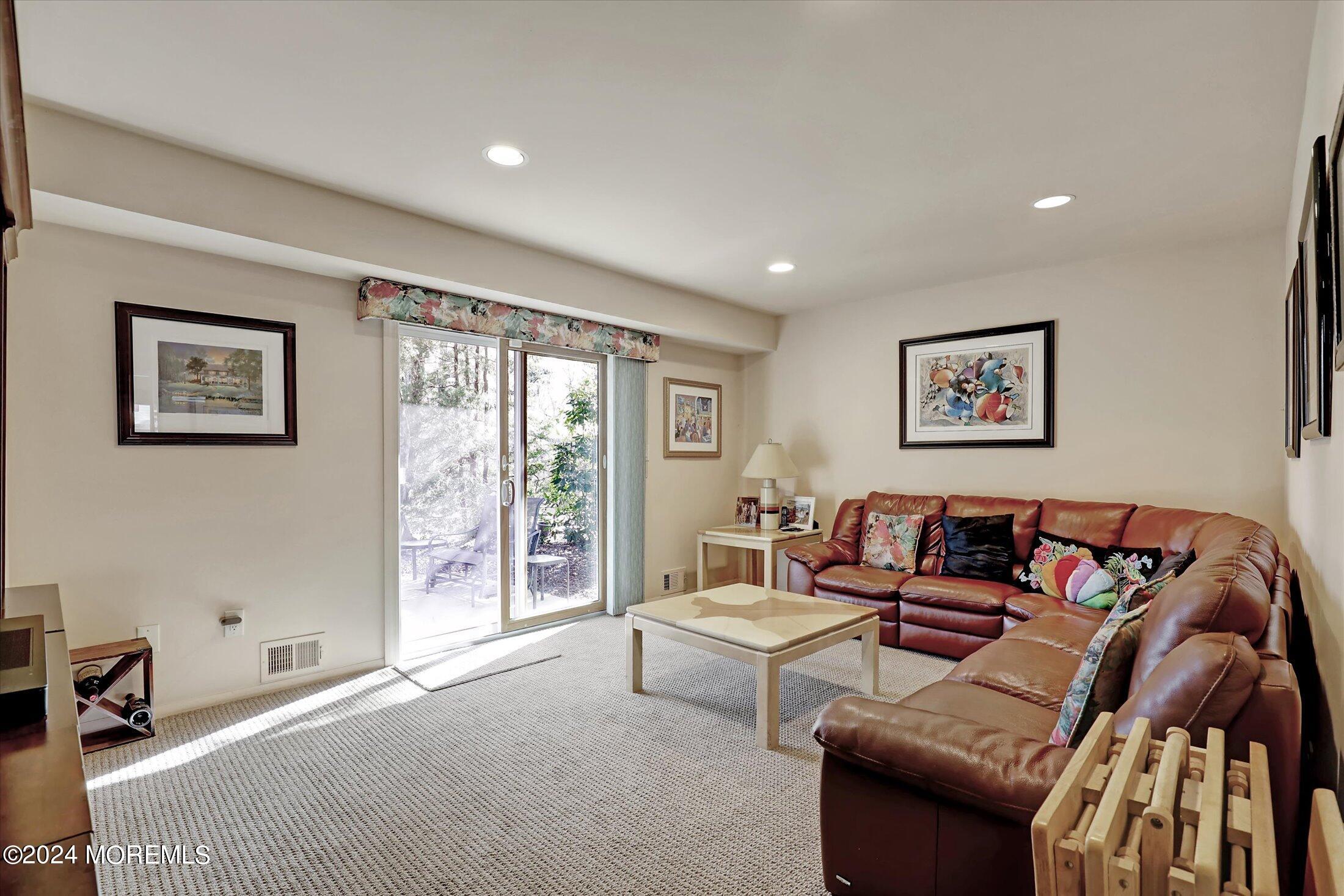 31 Shady Lane Freehold, NJ 07728 - Photo 10 of 40 a living room with furniture and large window