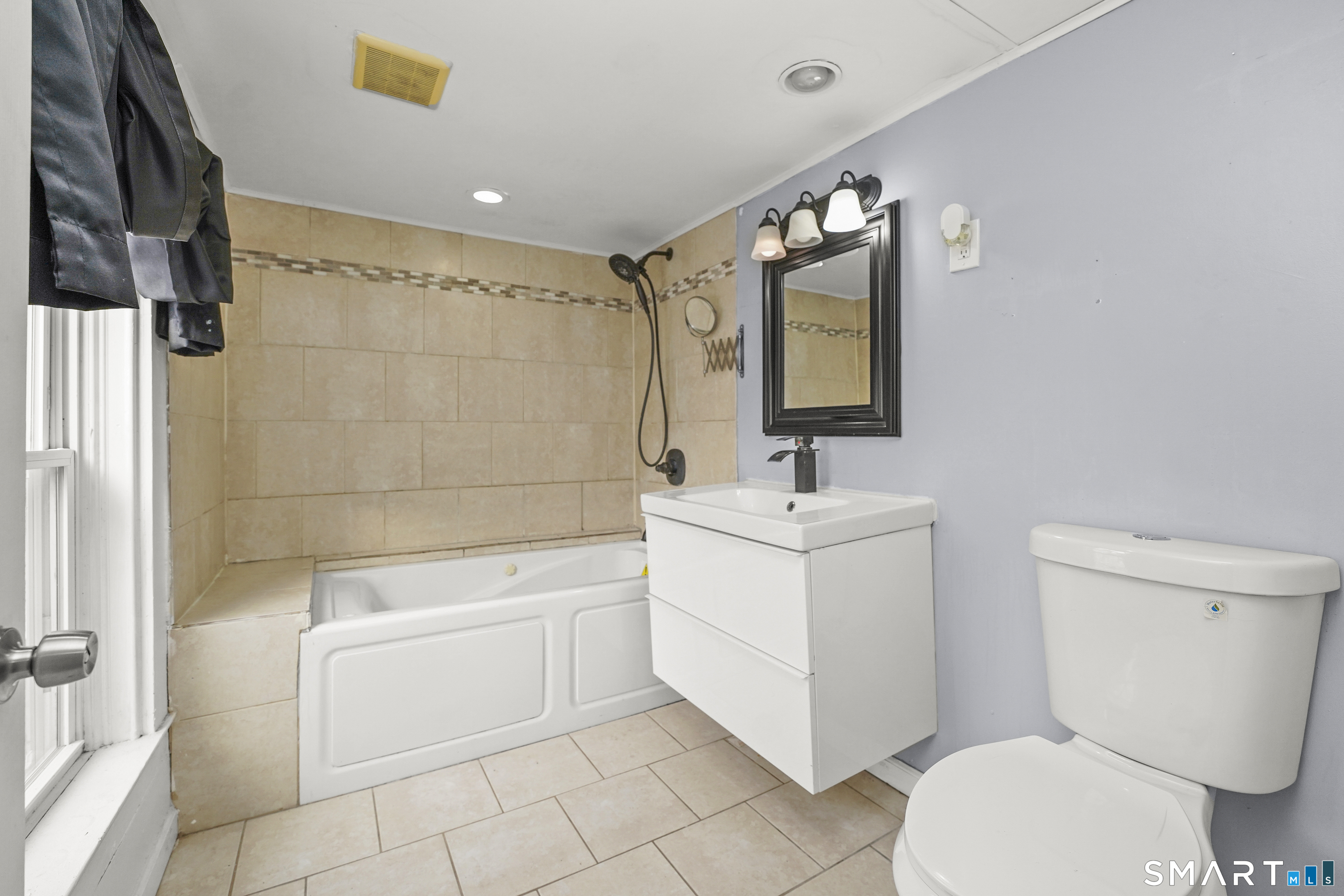 17 Windsor Street Enfield, CT 06082 - Photo 18 of 21 a bathroom with a sink toilet and shower