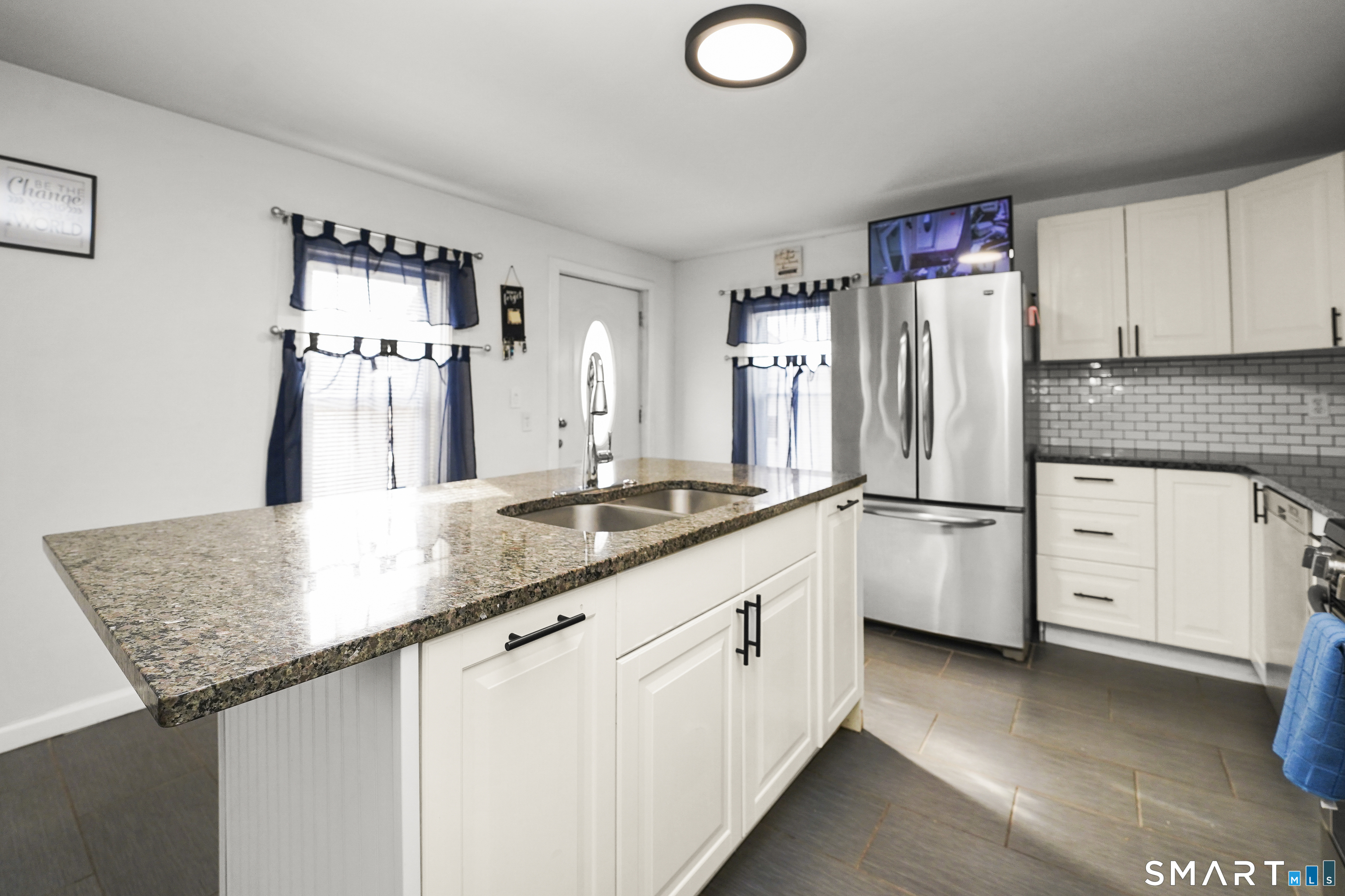 17 Windsor Street Enfield, CT 06082 - Photo 3 of 21 a kitchen with granite countertop a sink appliances cabinets and counter space