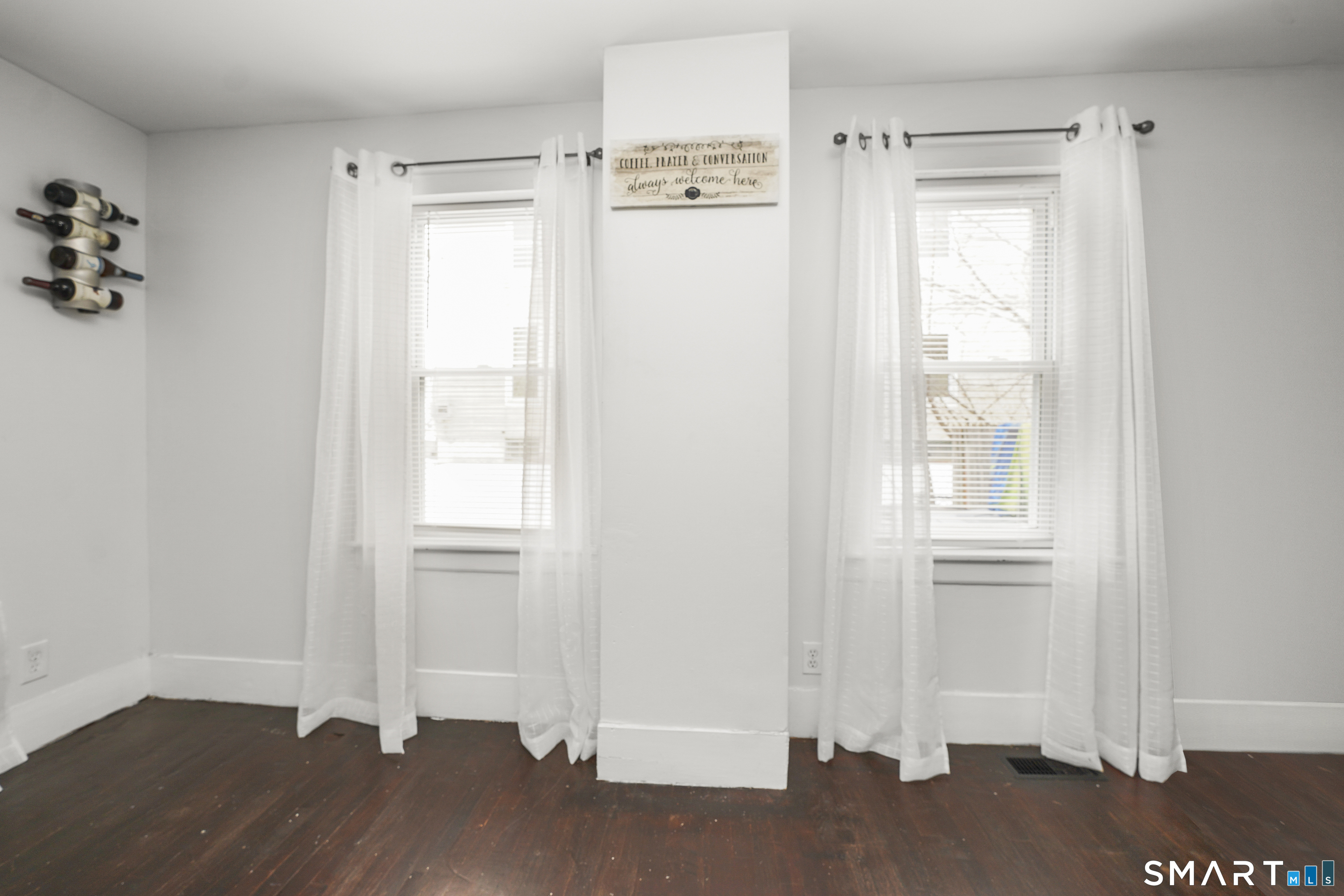 17 Windsor Street Enfield, CT 06082 - Photo 5 of 21 a view of empty room with wooden floor and fan