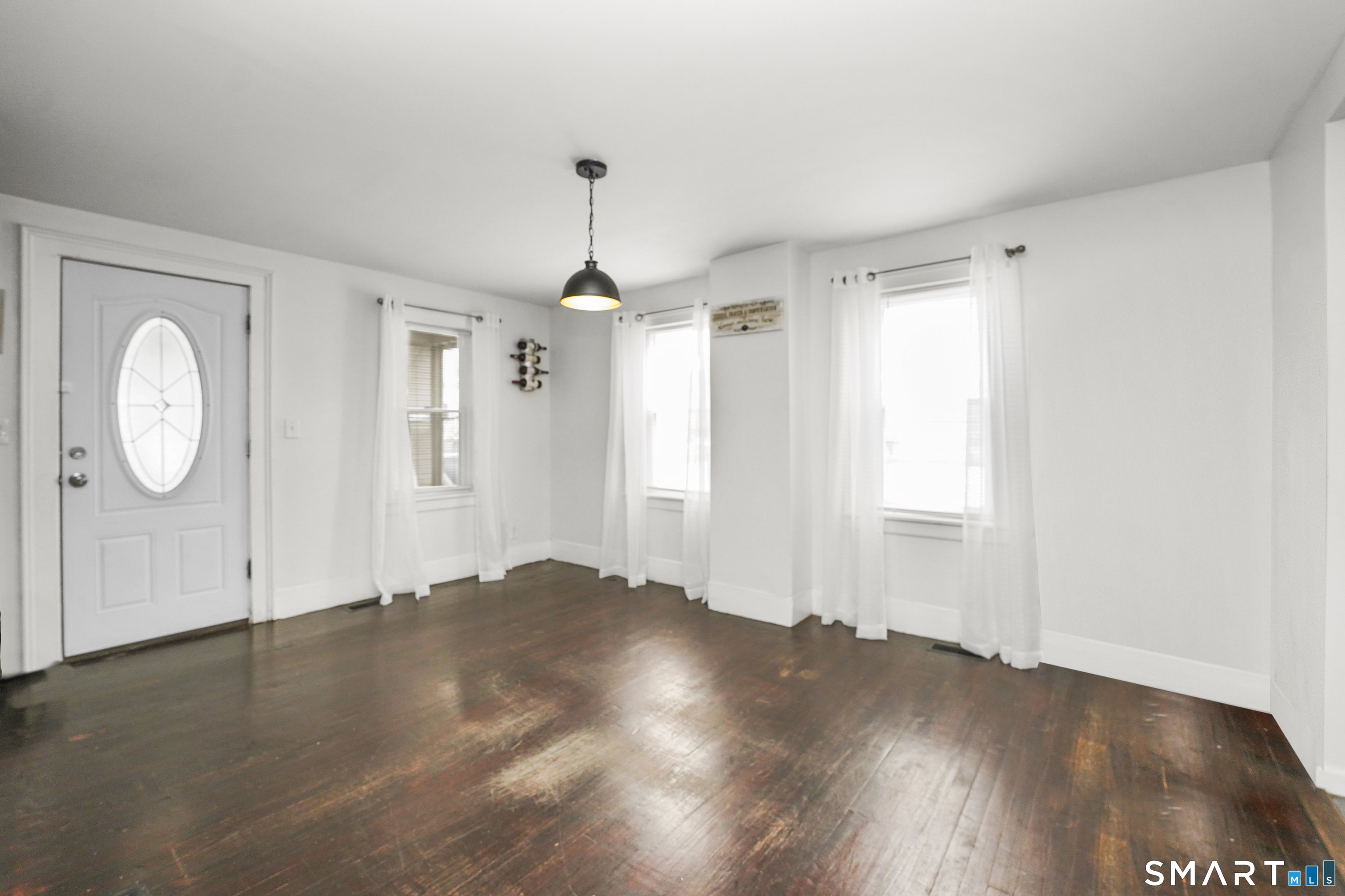 17 Windsor Street Enfield, CT 06082 - Photo 6 of 21 a view of a room with wooden floor and window