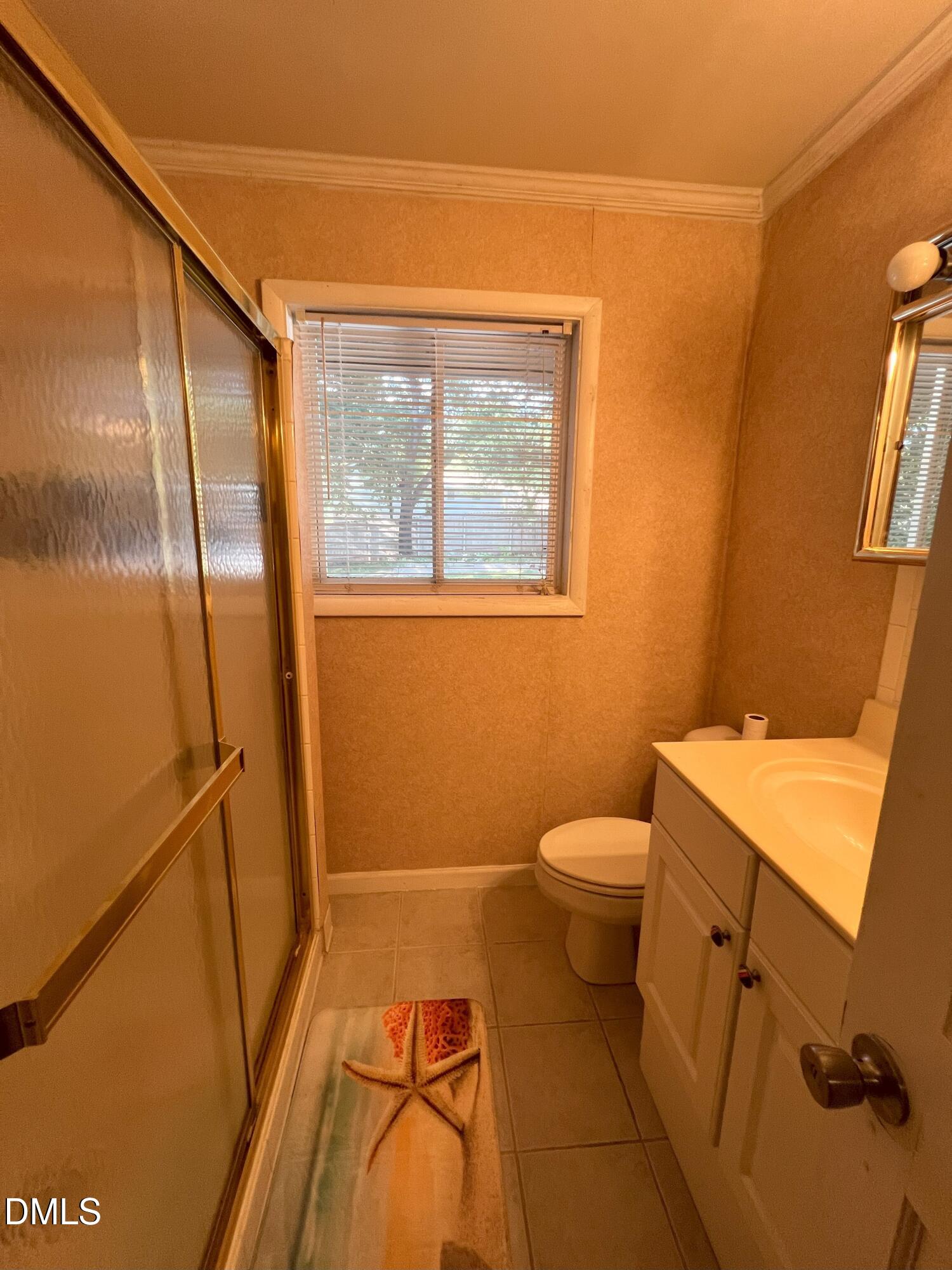 5002 Wickham Road Raleigh, NC 27606 - Photo 26 of 36 a bathroom with a granite countertop sink toilet and shower