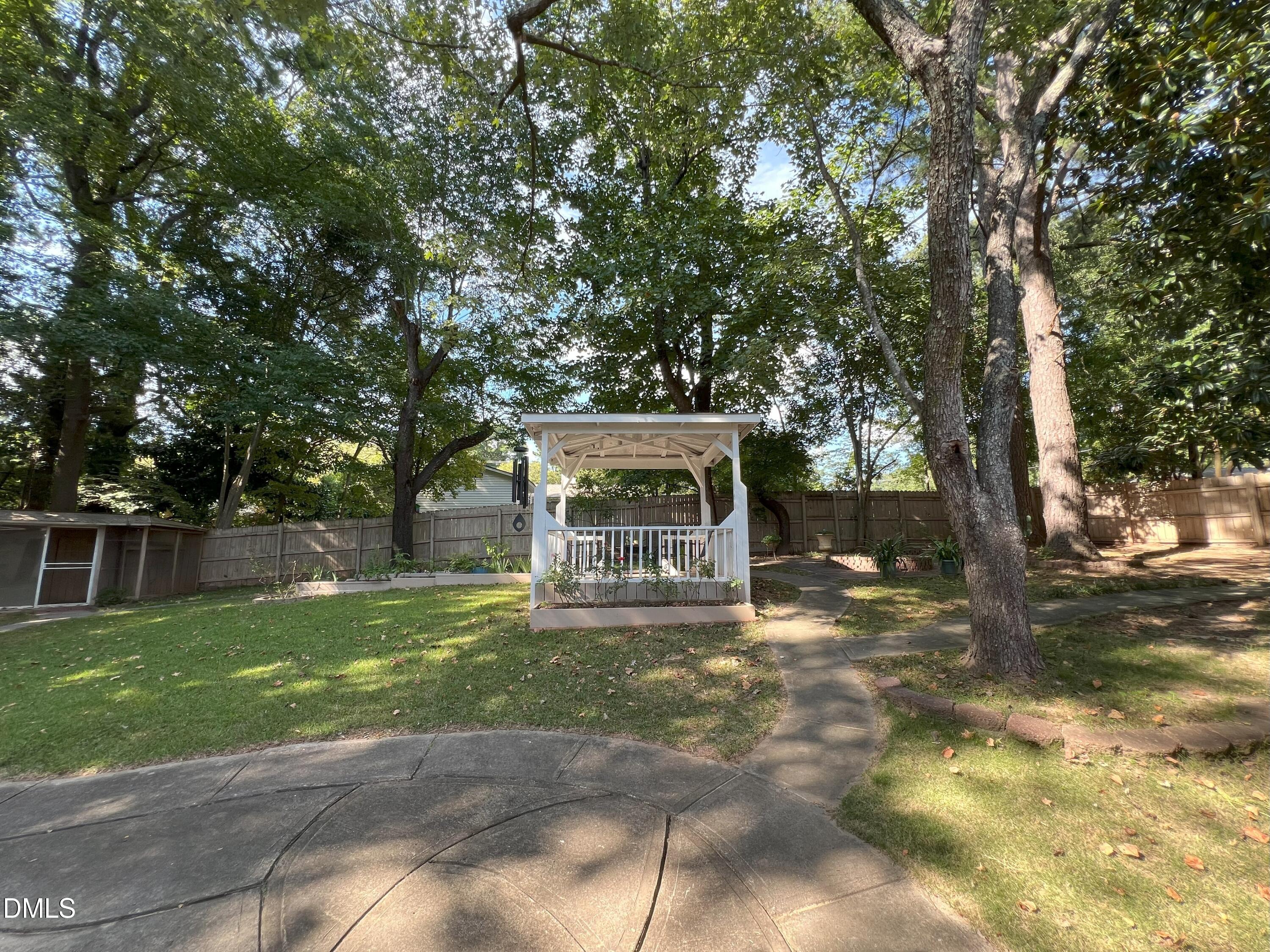 5002 Wickham Road Raleigh, NC 27606 - Photo 30 of 36 a view of a house with a yard