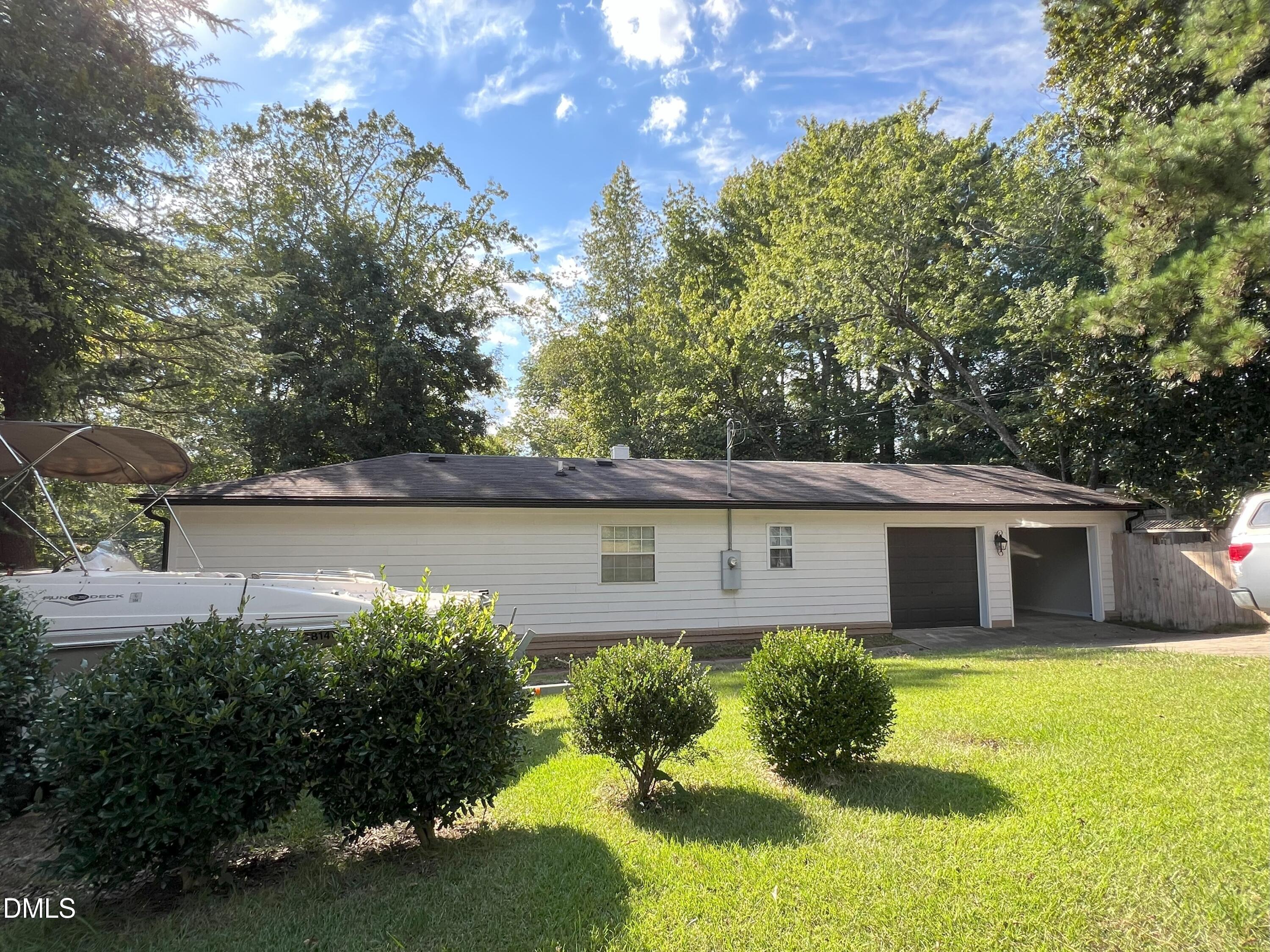 5002 Wickham Road Raleigh, NC 27606 - Photo 3 of 36 a front view of a house with garden