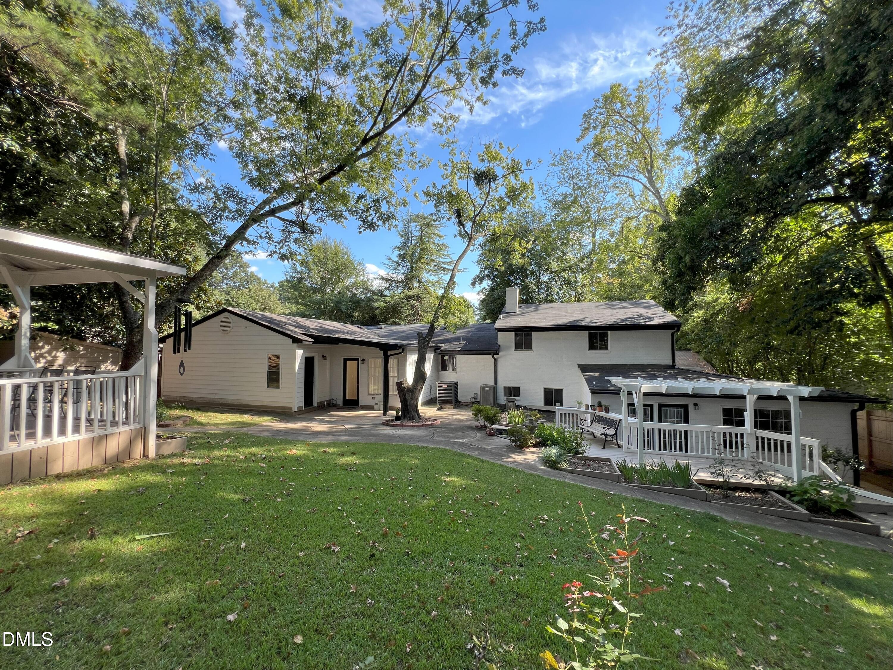 5002 Wickham Road Raleigh, NC 27606 - Photo 34 of 36 a front view of house with yard and green space