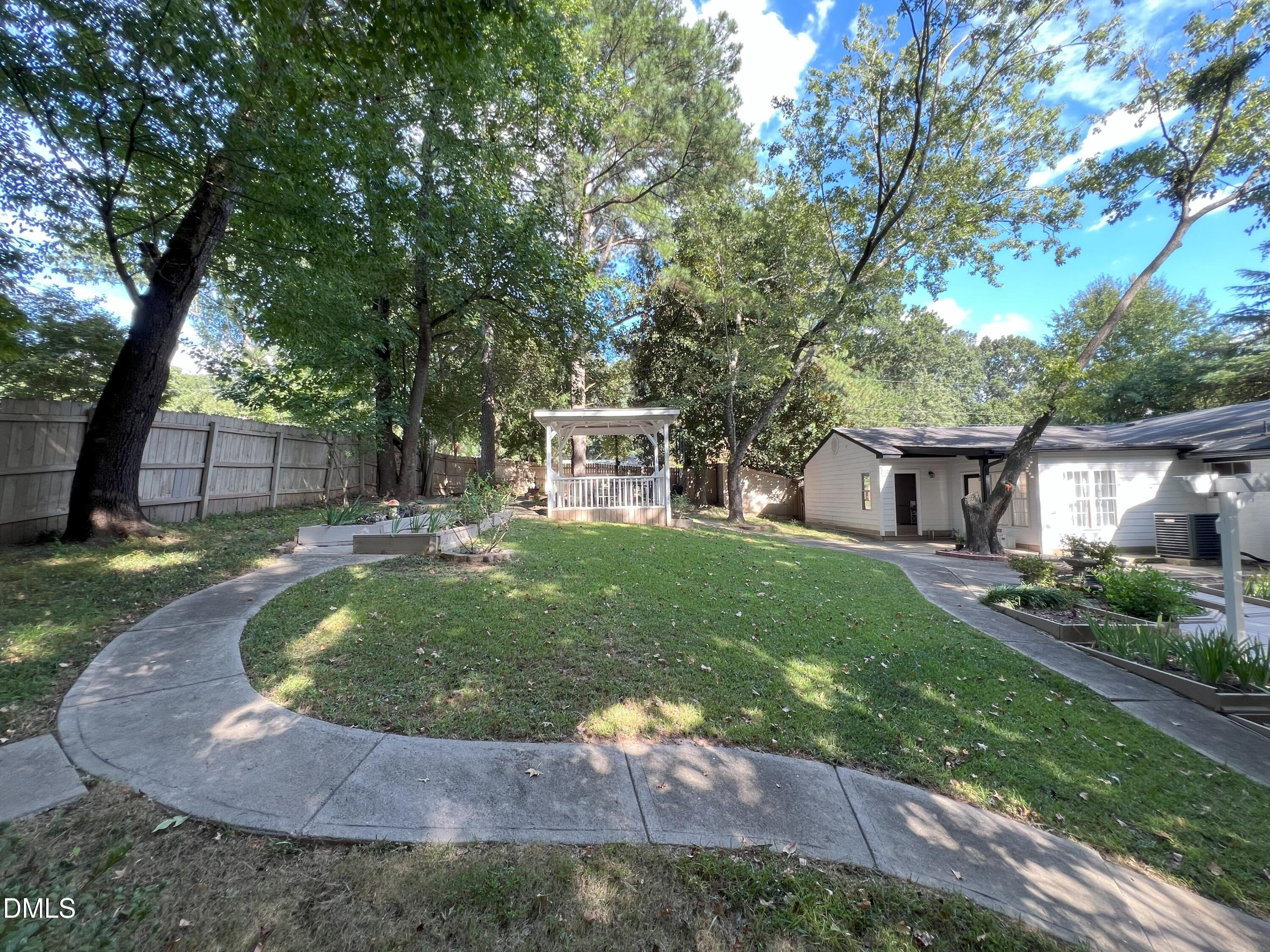 5002 Wickham Road Raleigh, NC 27606 - Photo 35 of 36 a view of a house with a yard