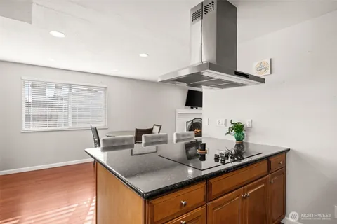 a kitchen with stainless steel appliances a counter space and a window