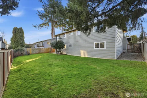 a view of a house with a yard porch and sitting area