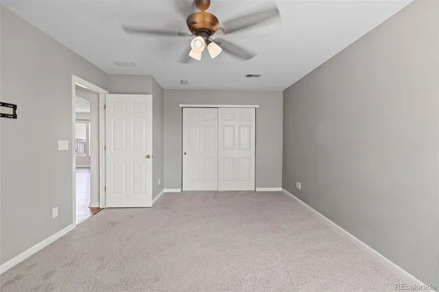 a view of a livingroom with a ceiling fan