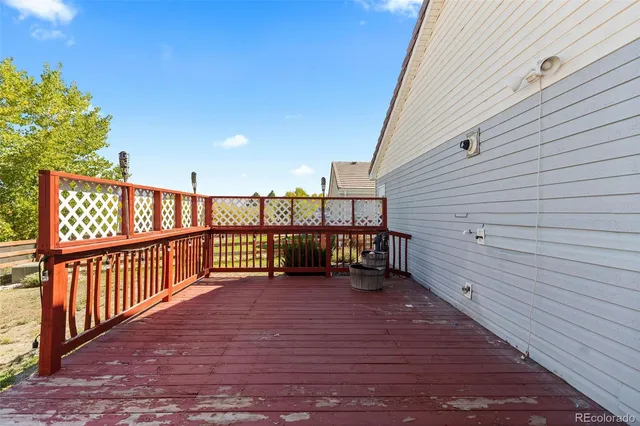 a view of a balcony with furniture
