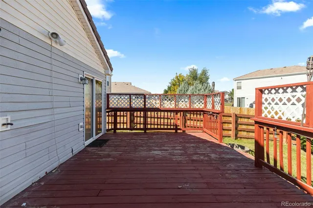 a view of balcony with wooden floor
