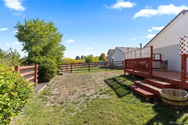 a view of a backyard with plants and a garden