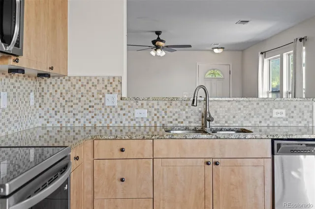 a kitchen with a sink and cabinets