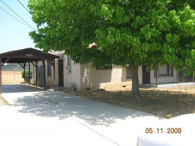 5445 Jones Avenue Riverside, CA 92505 - Photo 1 of 1 a view of a white house with a yard and large tree