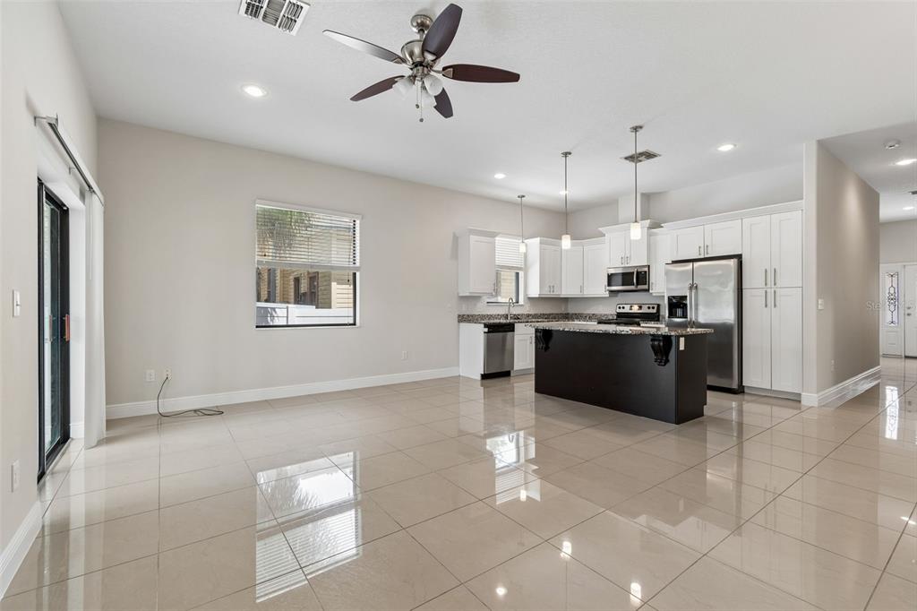 2311 West Aileen Street Tampa, FL 33607 - Photo 17 of 38 a large kitchen with cabinets and stainless steel appliances