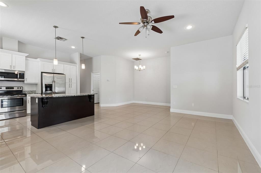2311 West Aileen Street Tampa, FL 33607 - Photo 18 of 38 a large kitchen with cabinets and stainless steel appliances