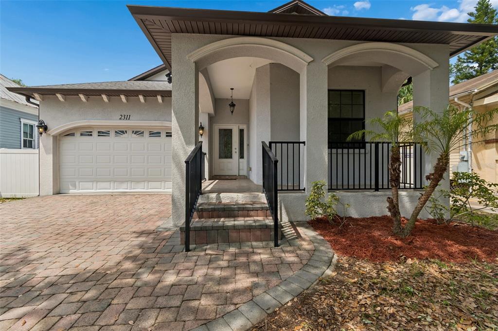 2311 West Aileen Street Tampa, FL 33607 - Photo 2 of 38 a view of a house with a porch
