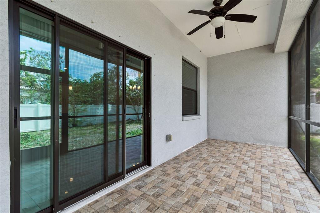 2311 West Aileen Street Tampa, FL 33607 - Photo 28 of 38 a view of empty room with wooden floor and fan